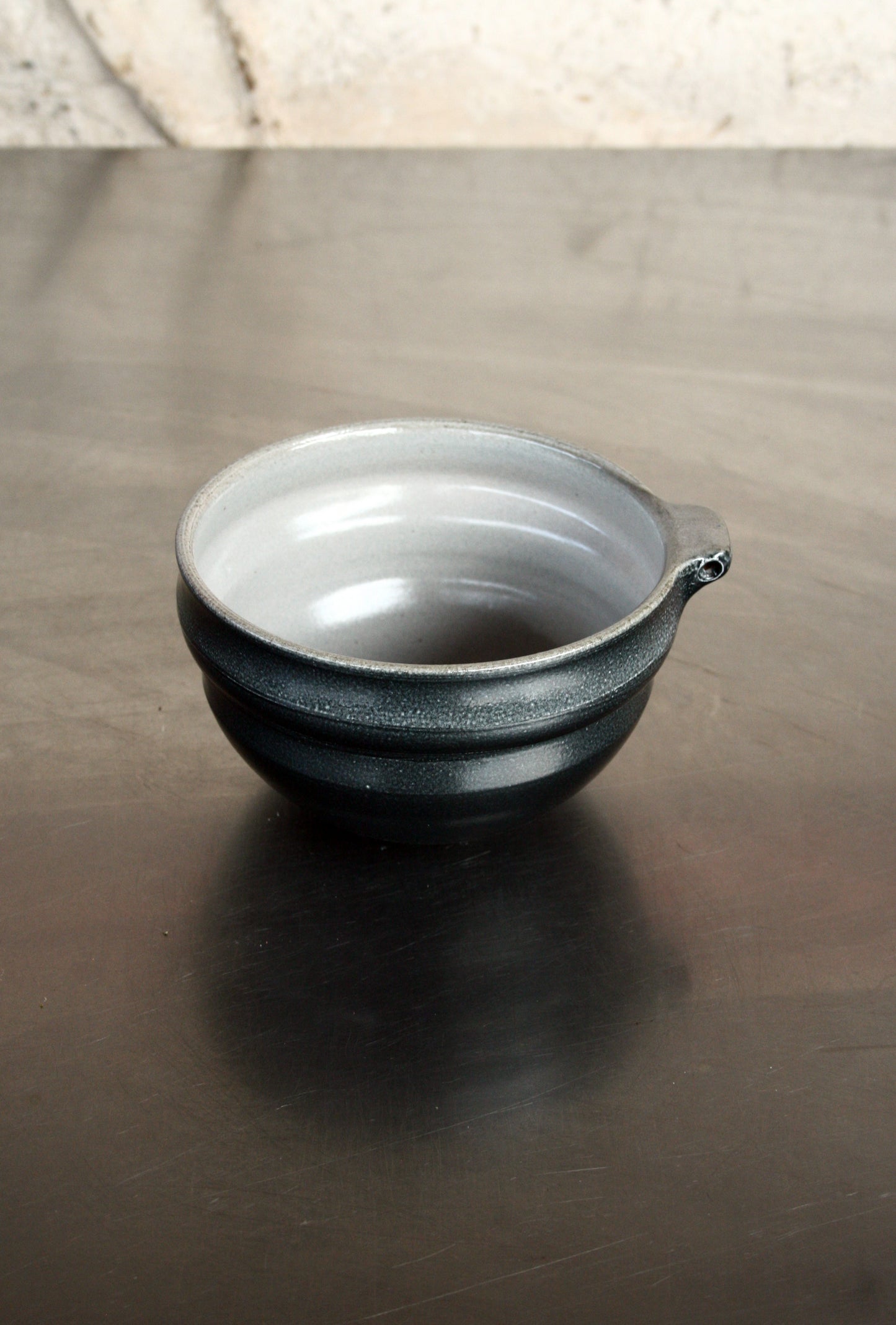 Bowl with pierced lug