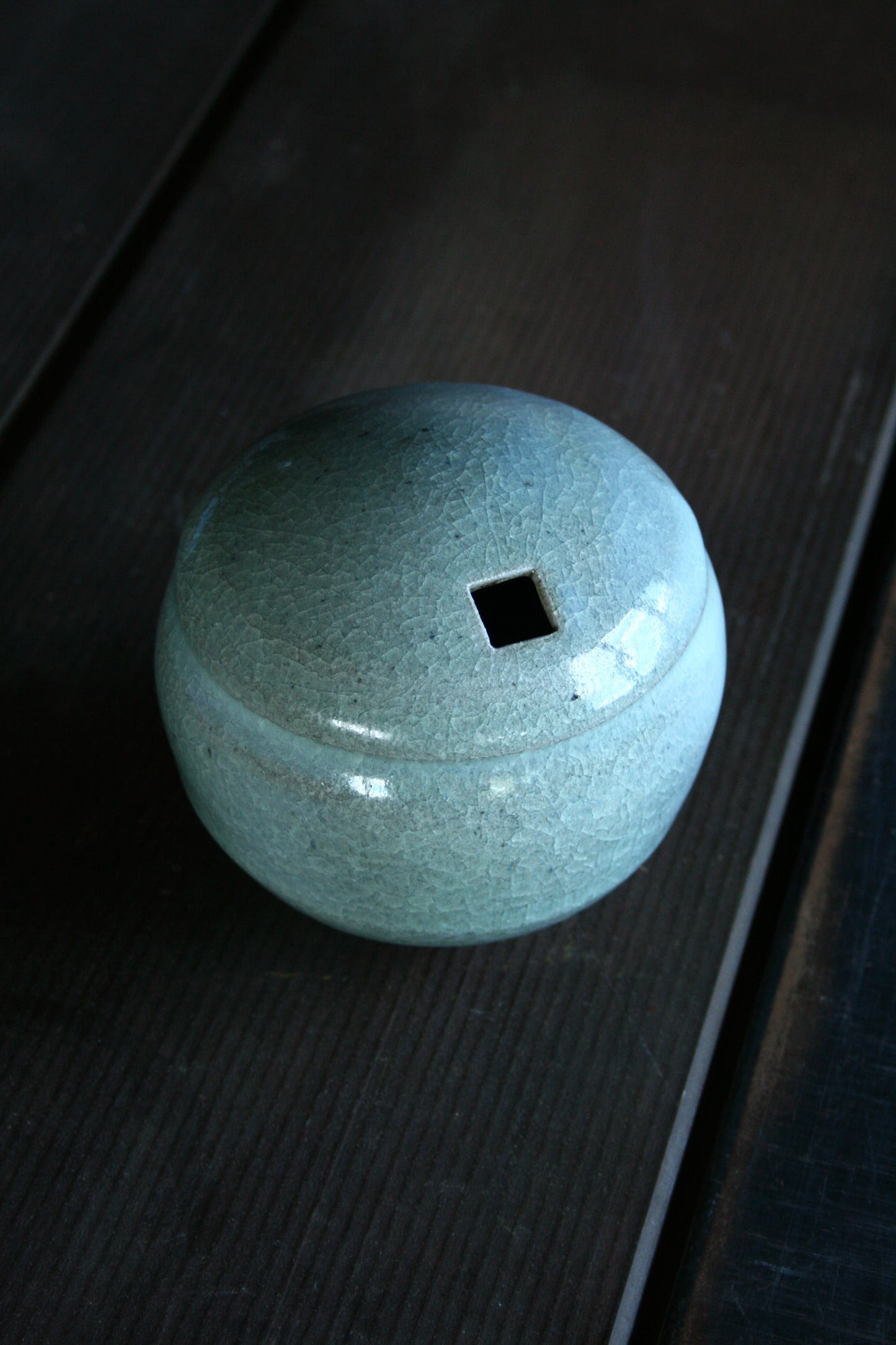 Enclosed form vase