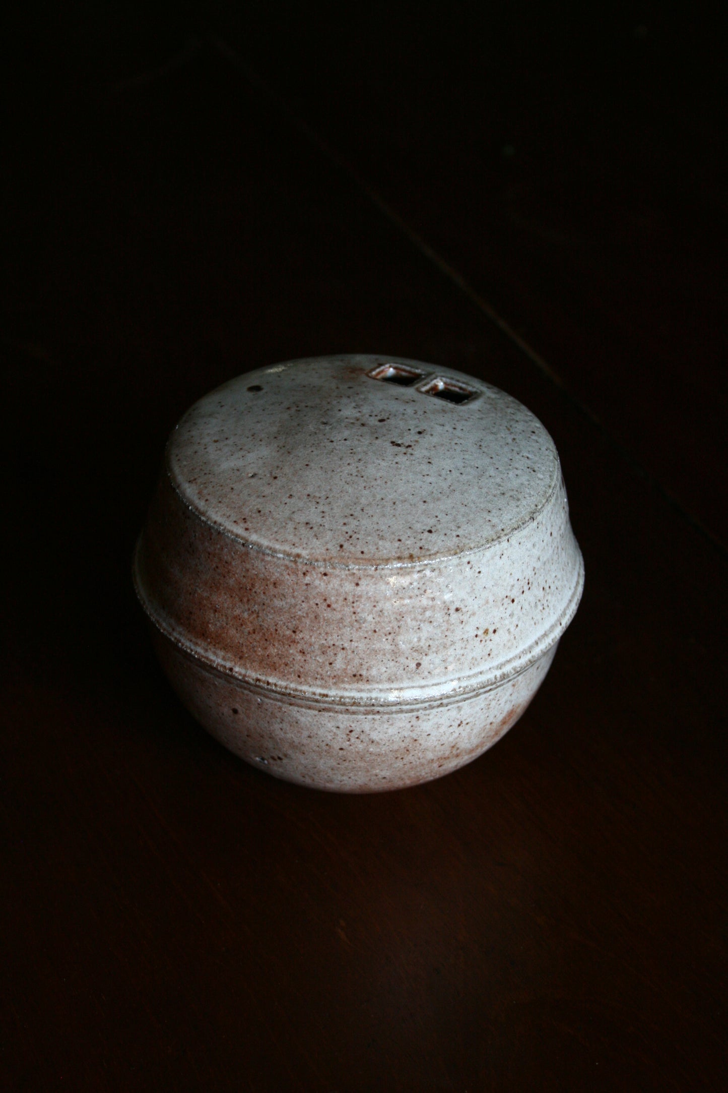 Enclosed form vase with double square opening