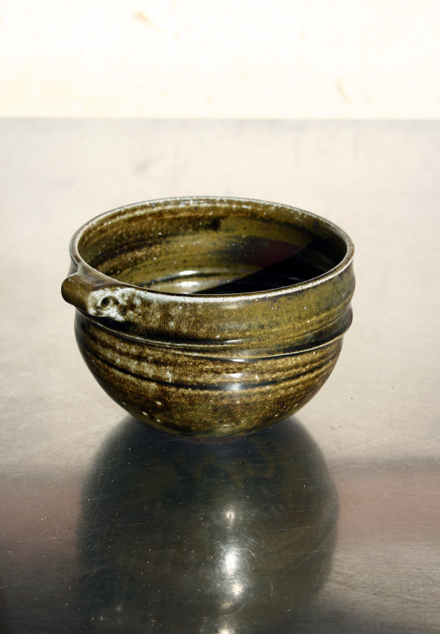 Bowl with pierced lug