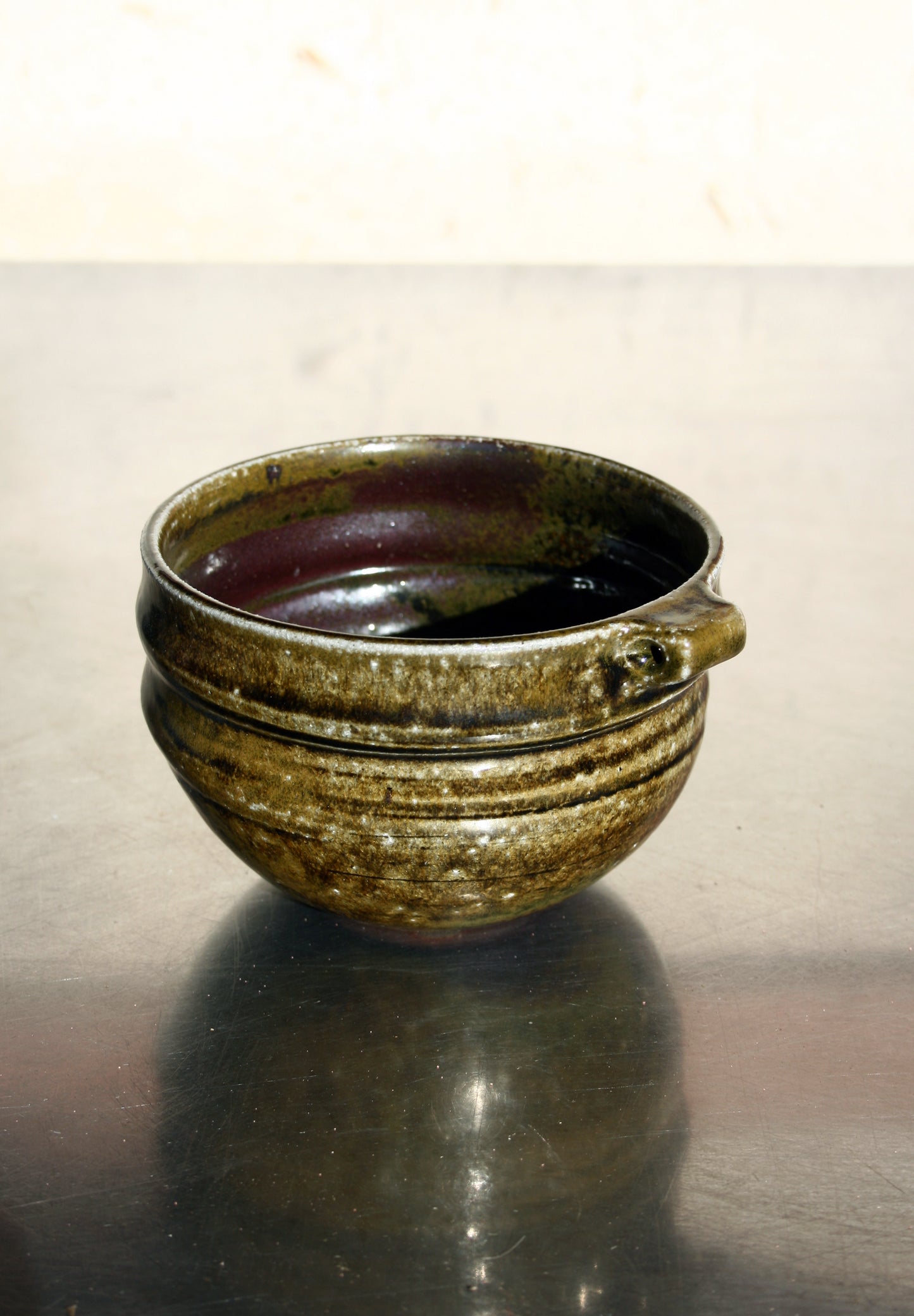 Bowl with pierced lug