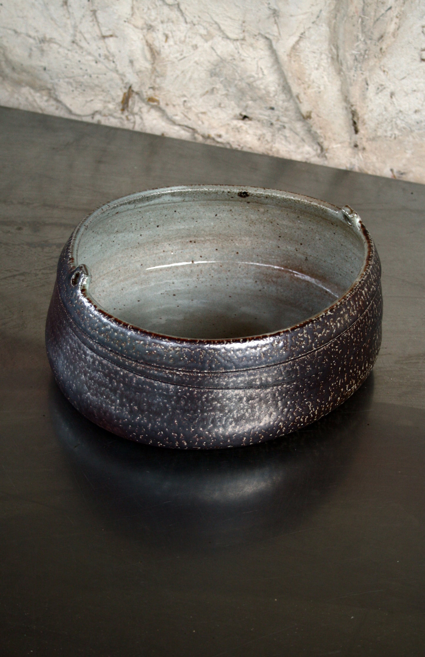 Asymmetric dish with lugs