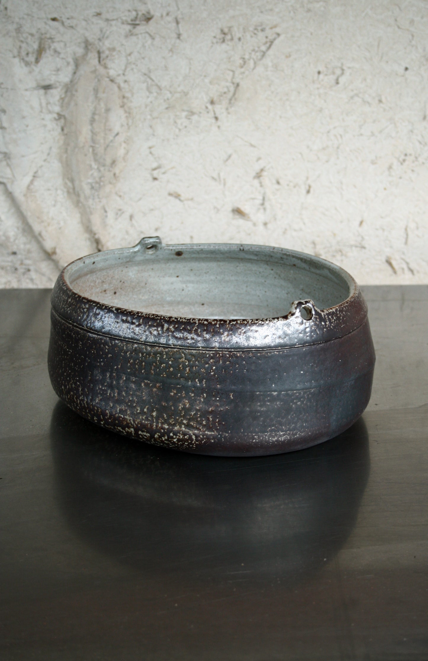 Asymmetric dish with lugs