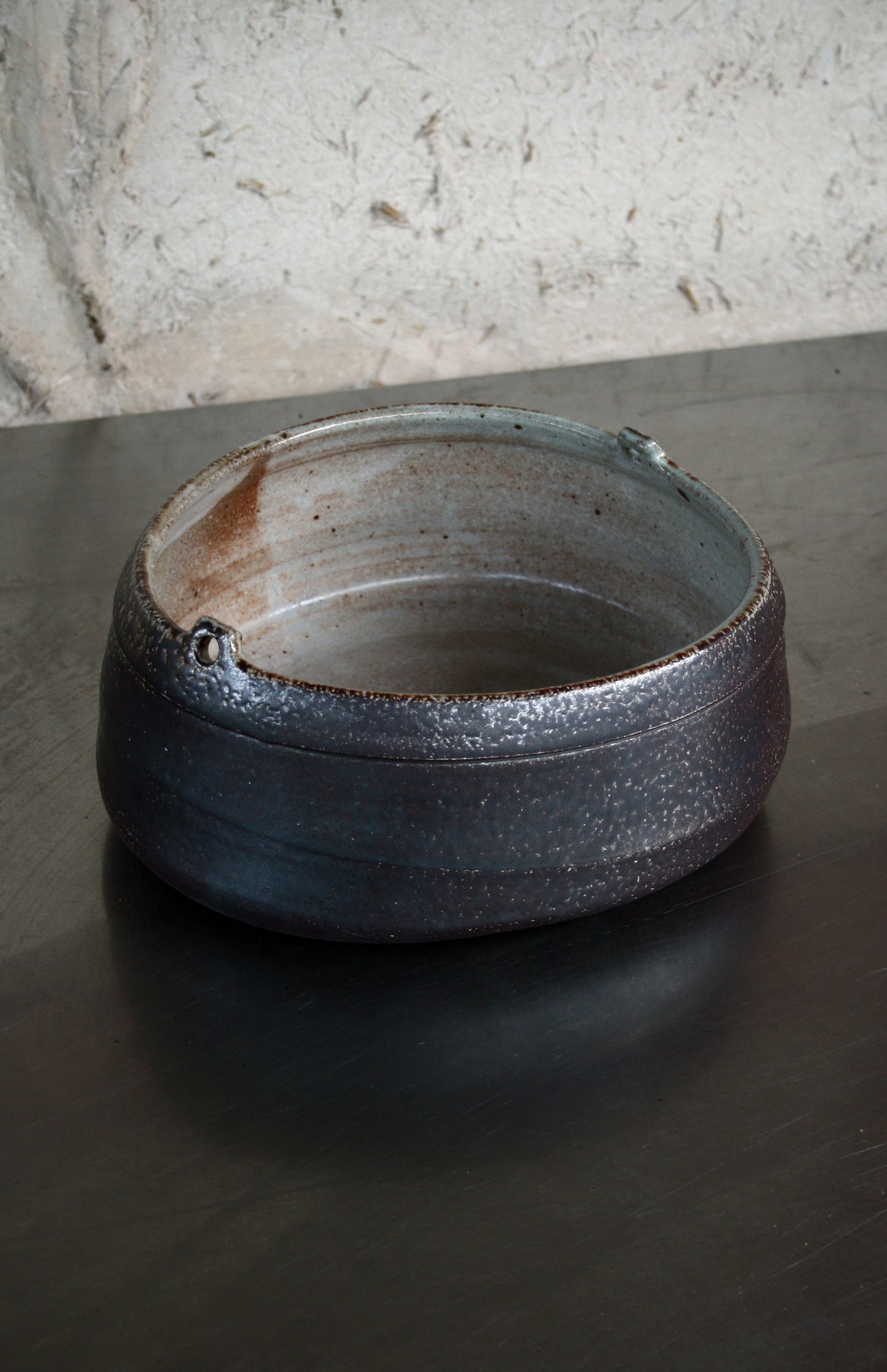 Asymmetric dish with lugs