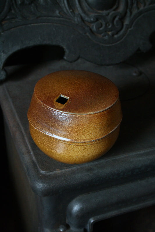 Enclosed form vase with square opening