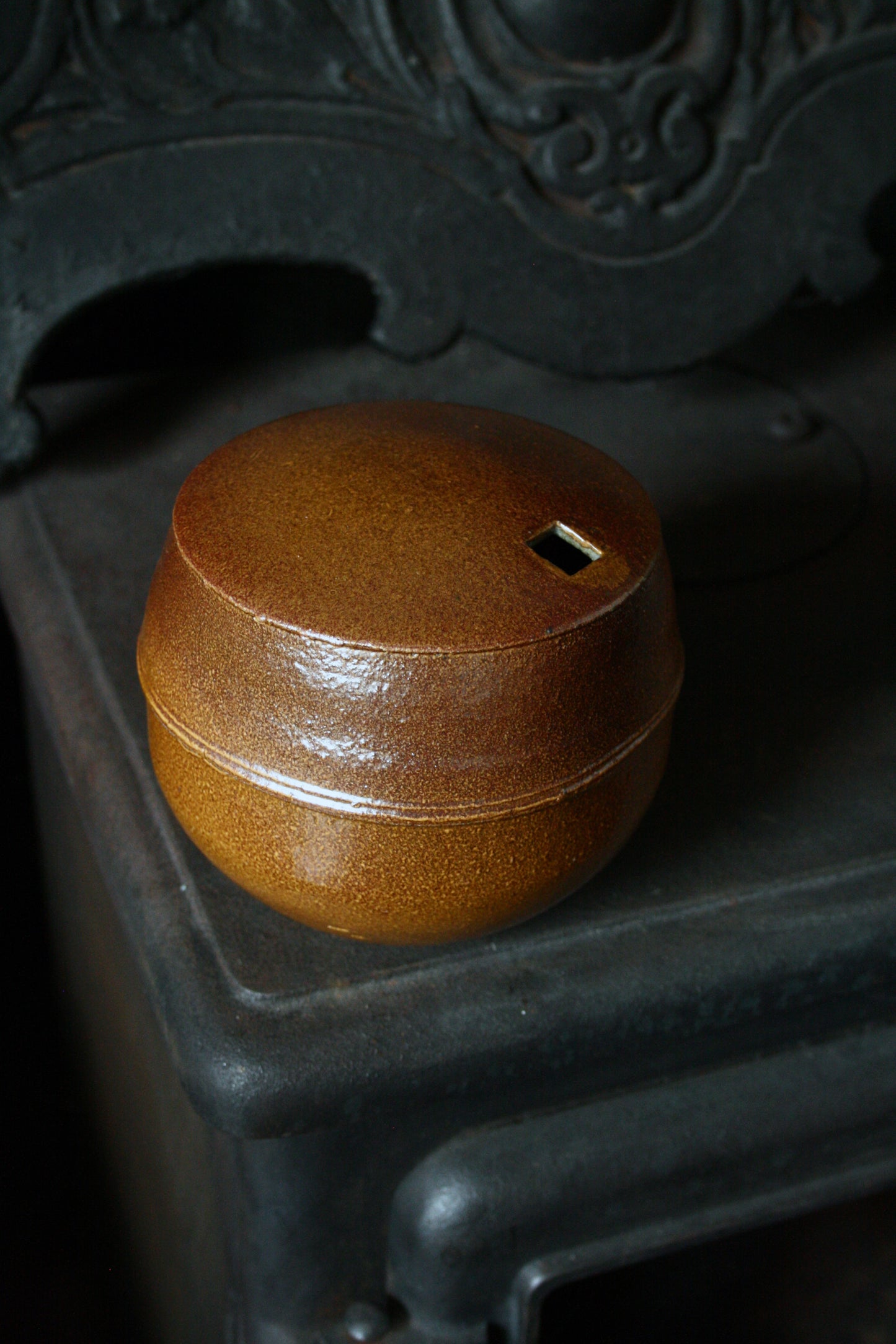 Enclosed form vase with square opening