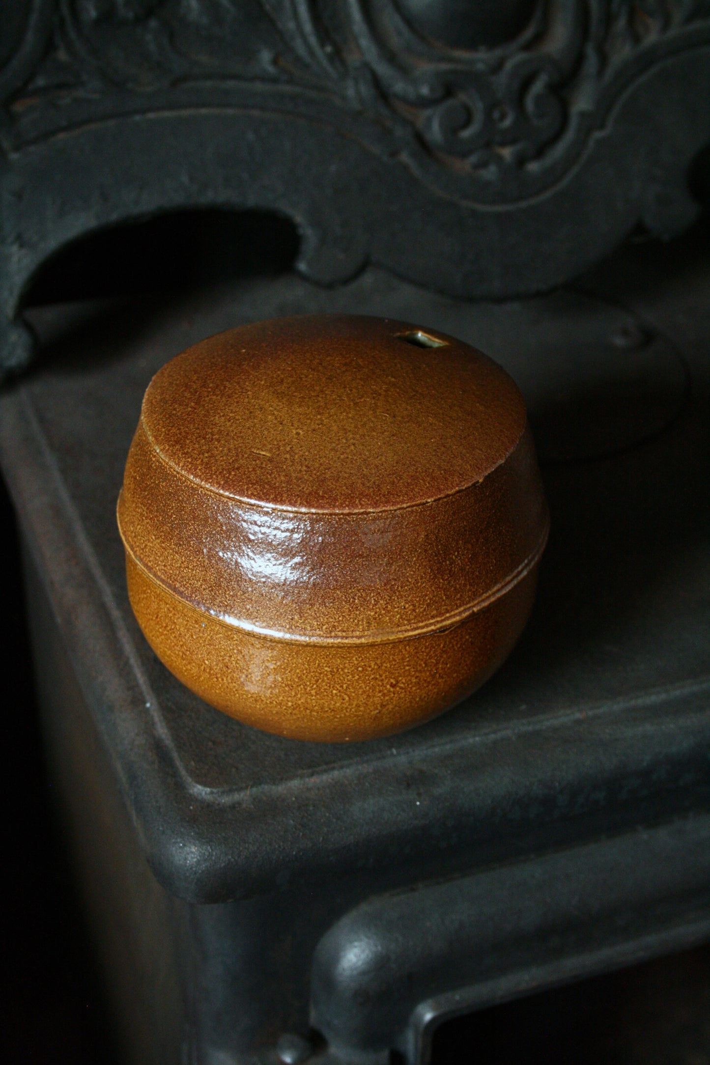 Enclosed form vase with square opening