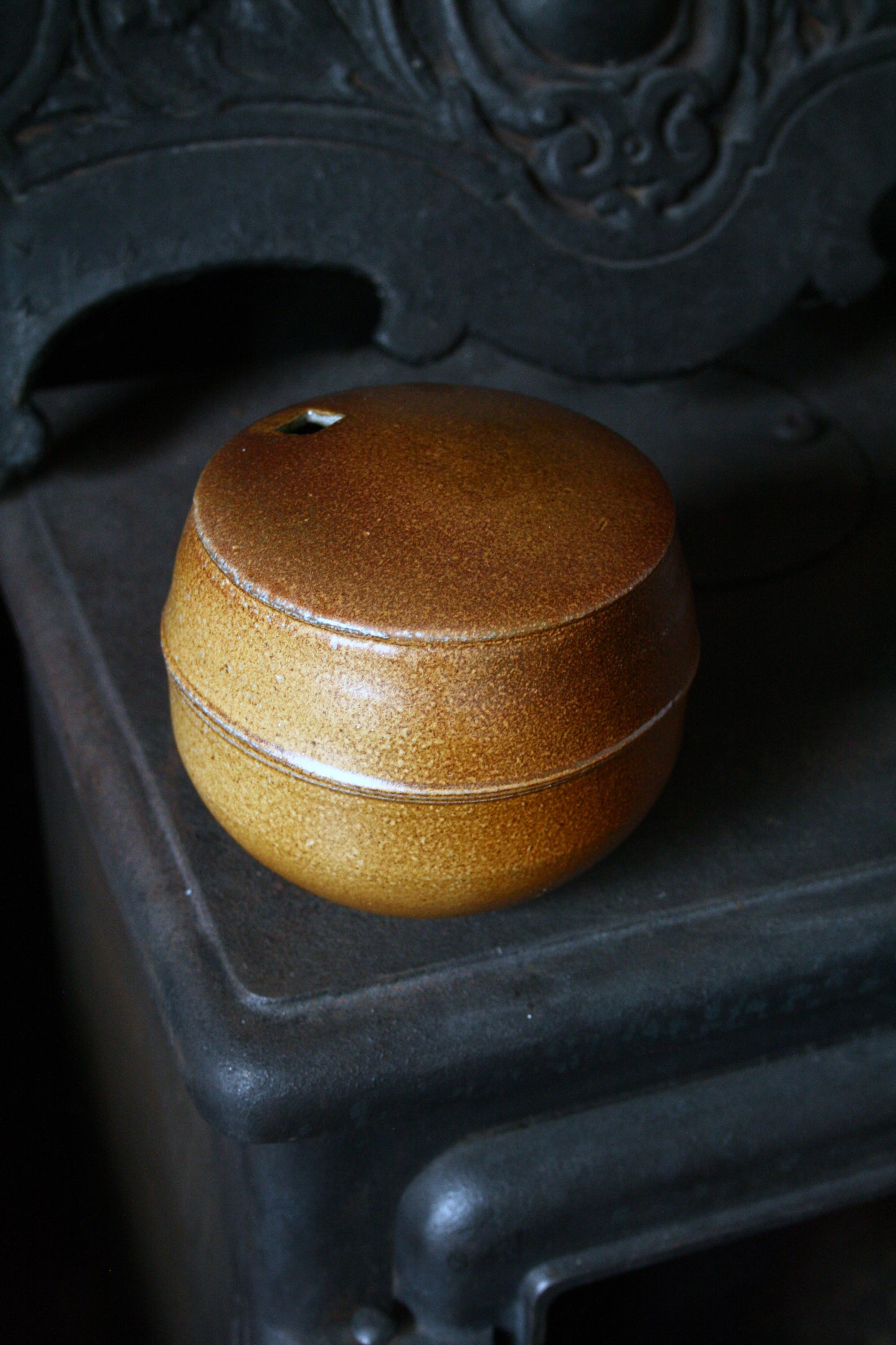 Enclosed form vase with square opening