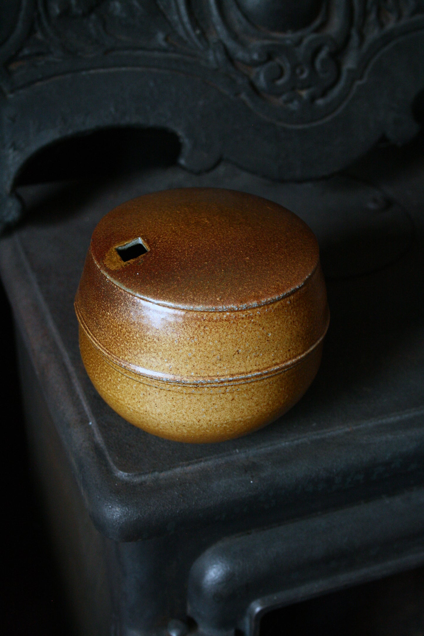 Enclosed form vase with square opening