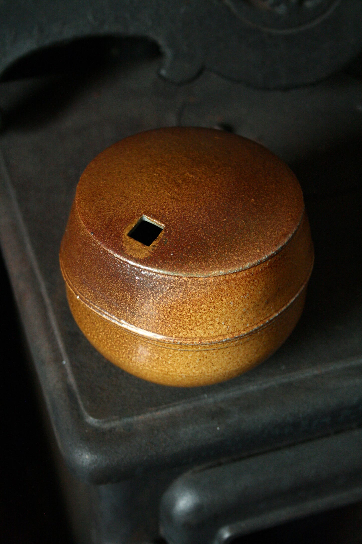 Enclosed form vase with square opening