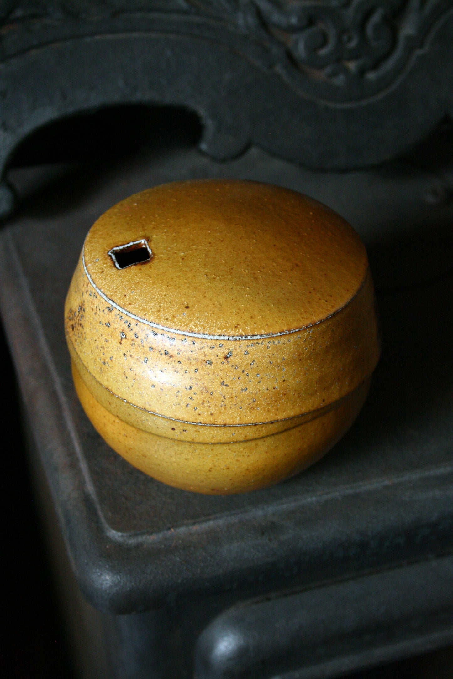 Enclosed form vase with square opening
