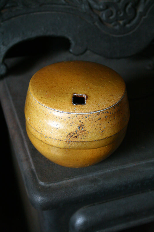 Enclosed form vase with square opening