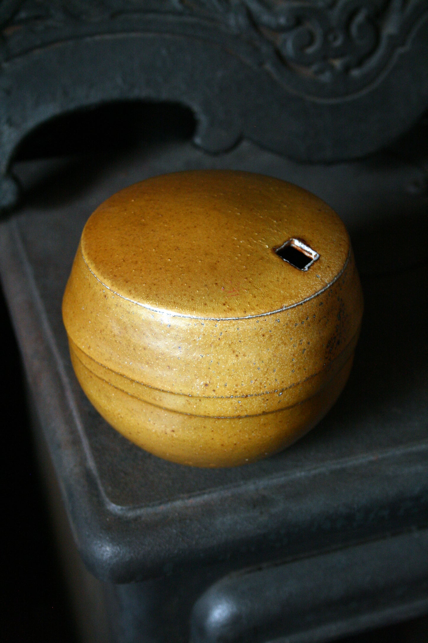 Enclosed form vase with square opening