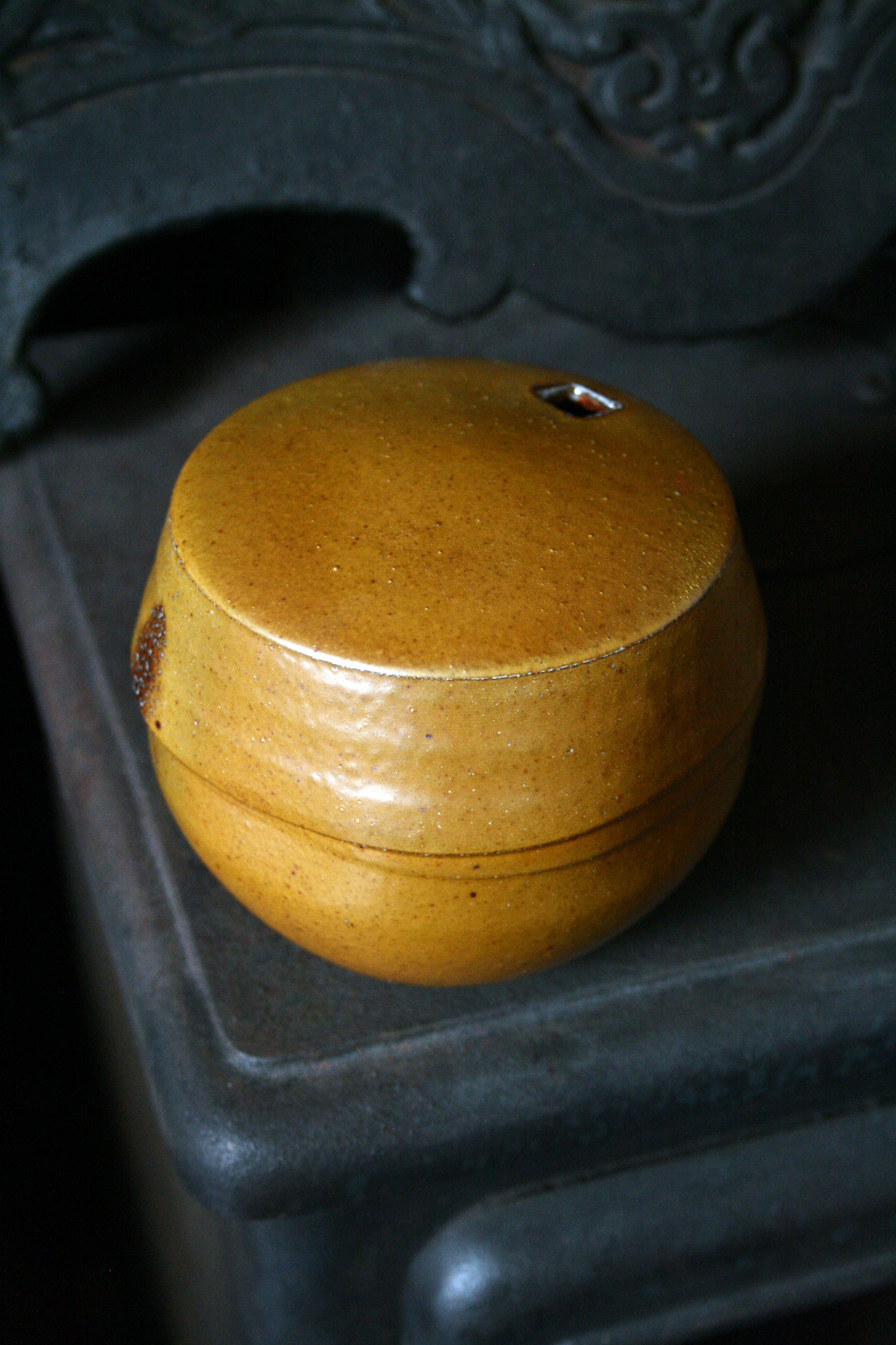 Enclosed form vase with square opening