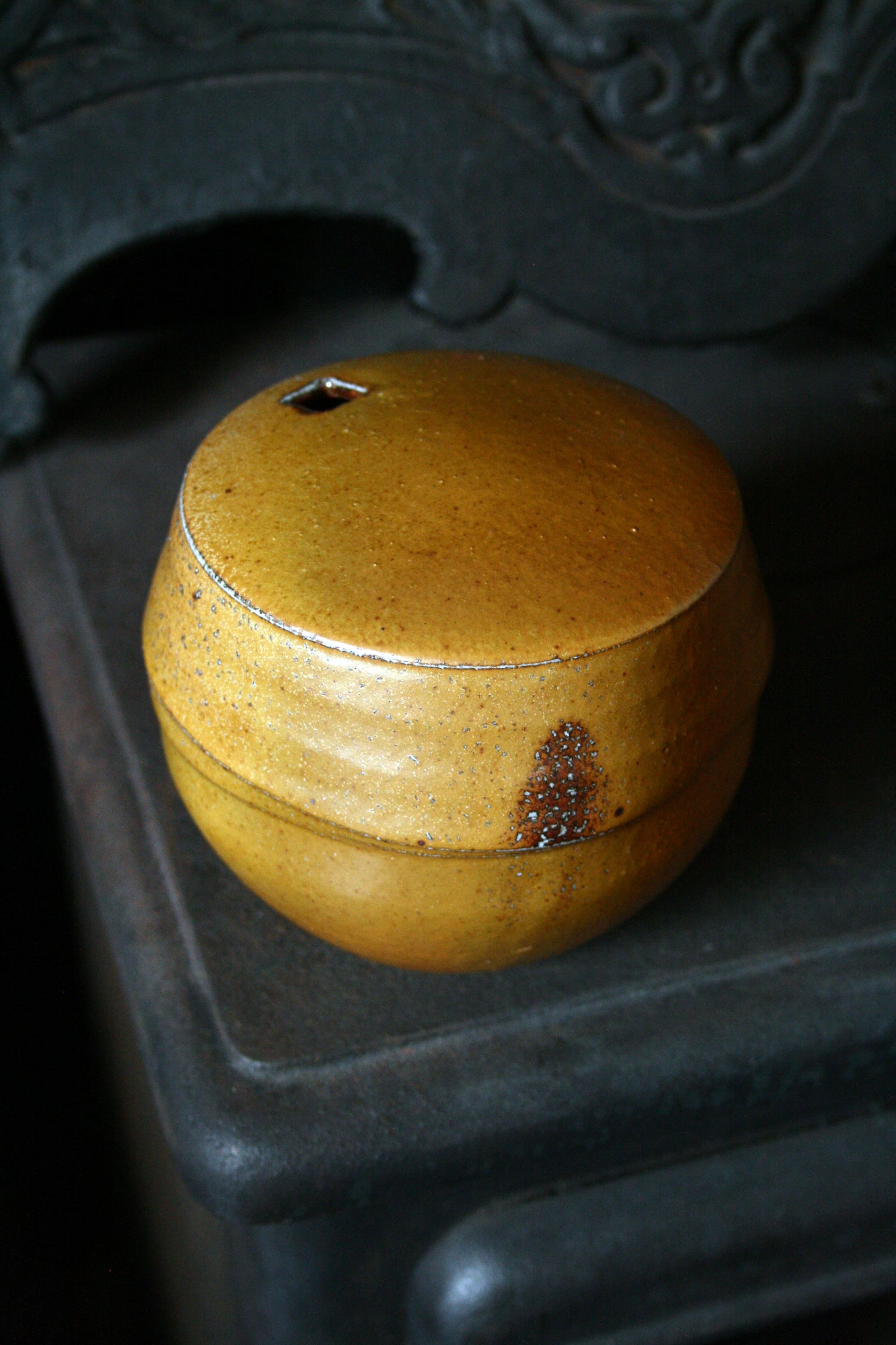 Enclosed form vase with square opening