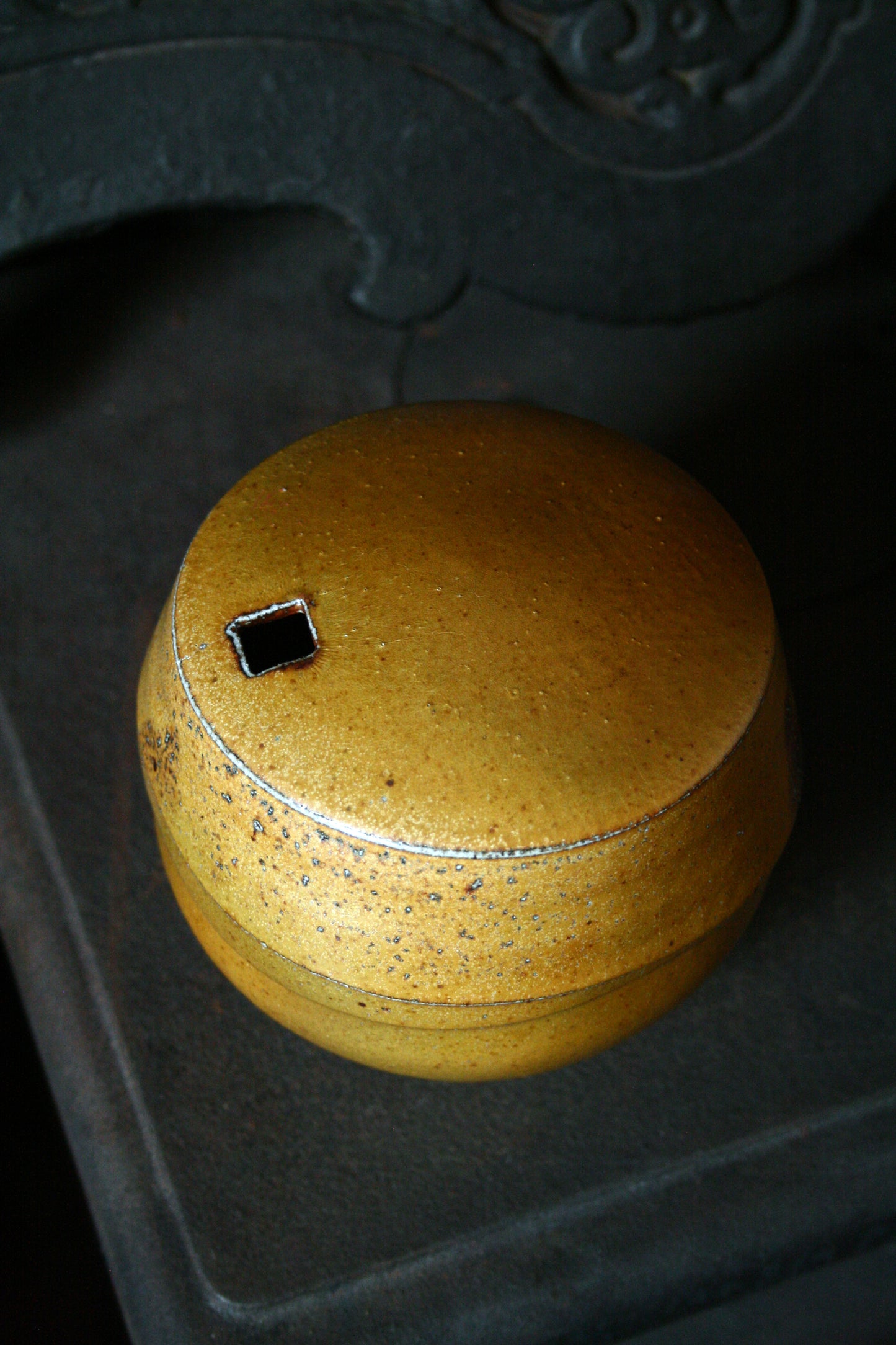 Enclosed form vase with square opening