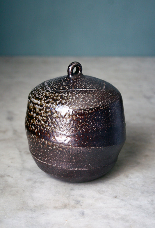 Jar with carved lid