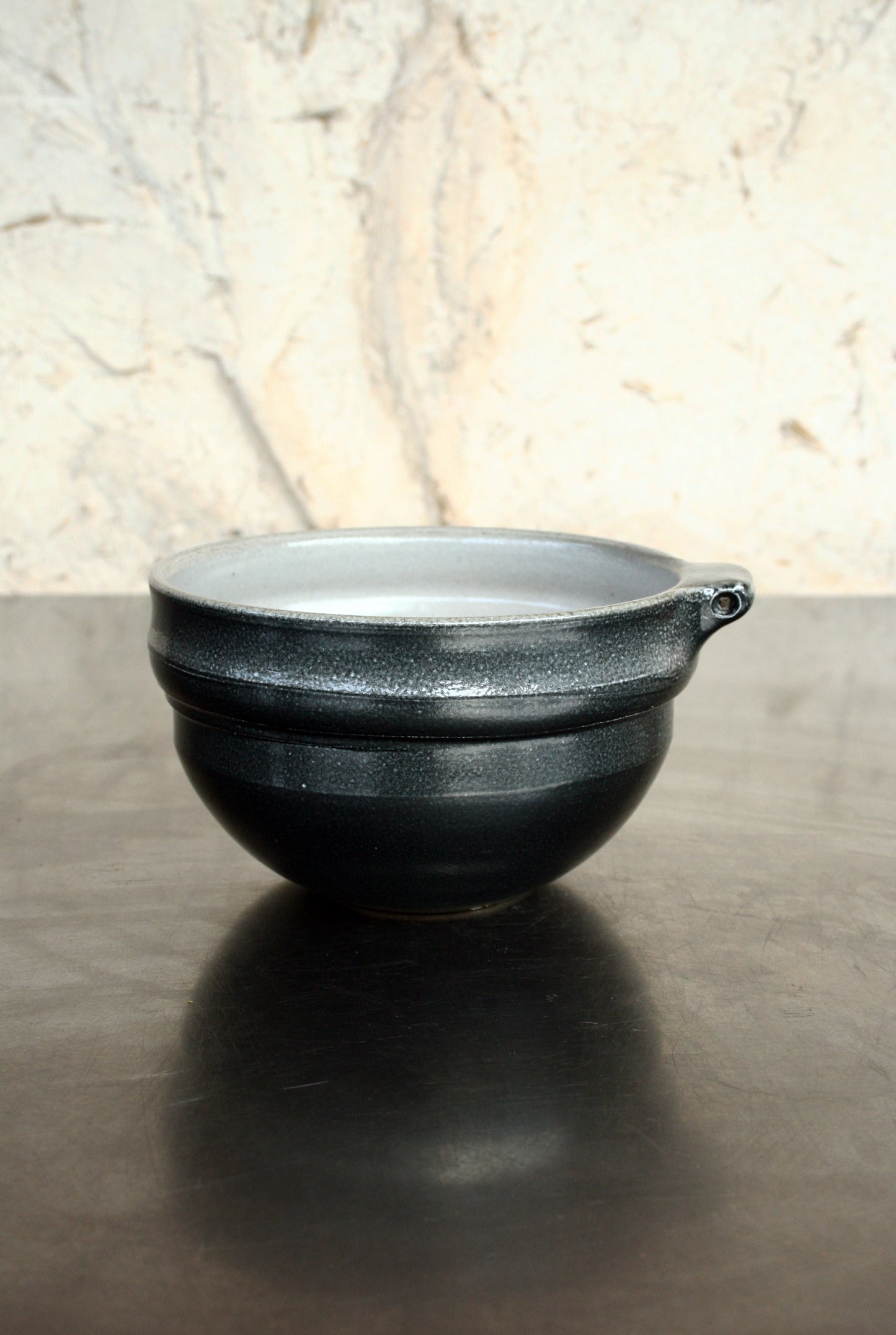 Bowl with pierced lug