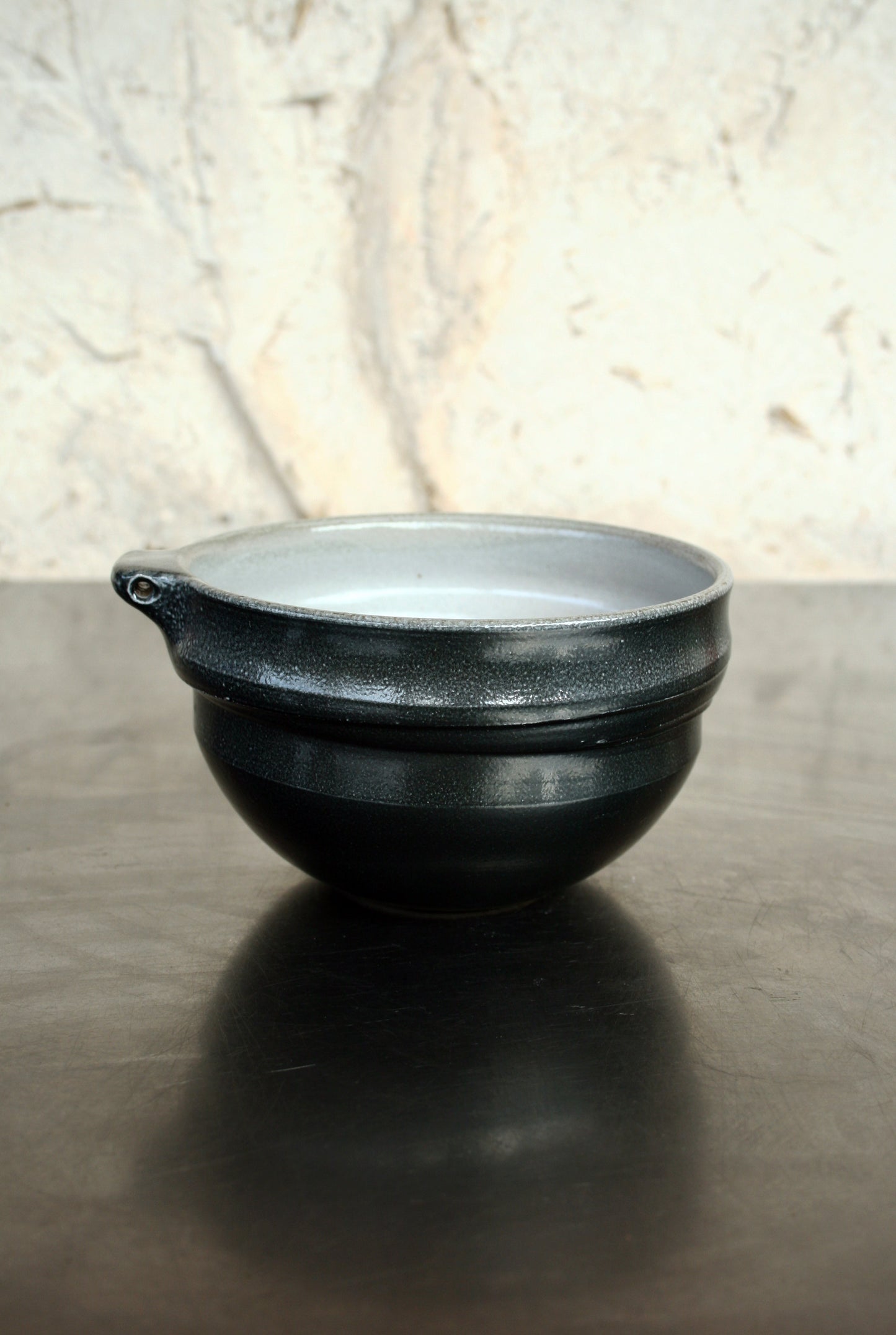 Bowl with pierced lug