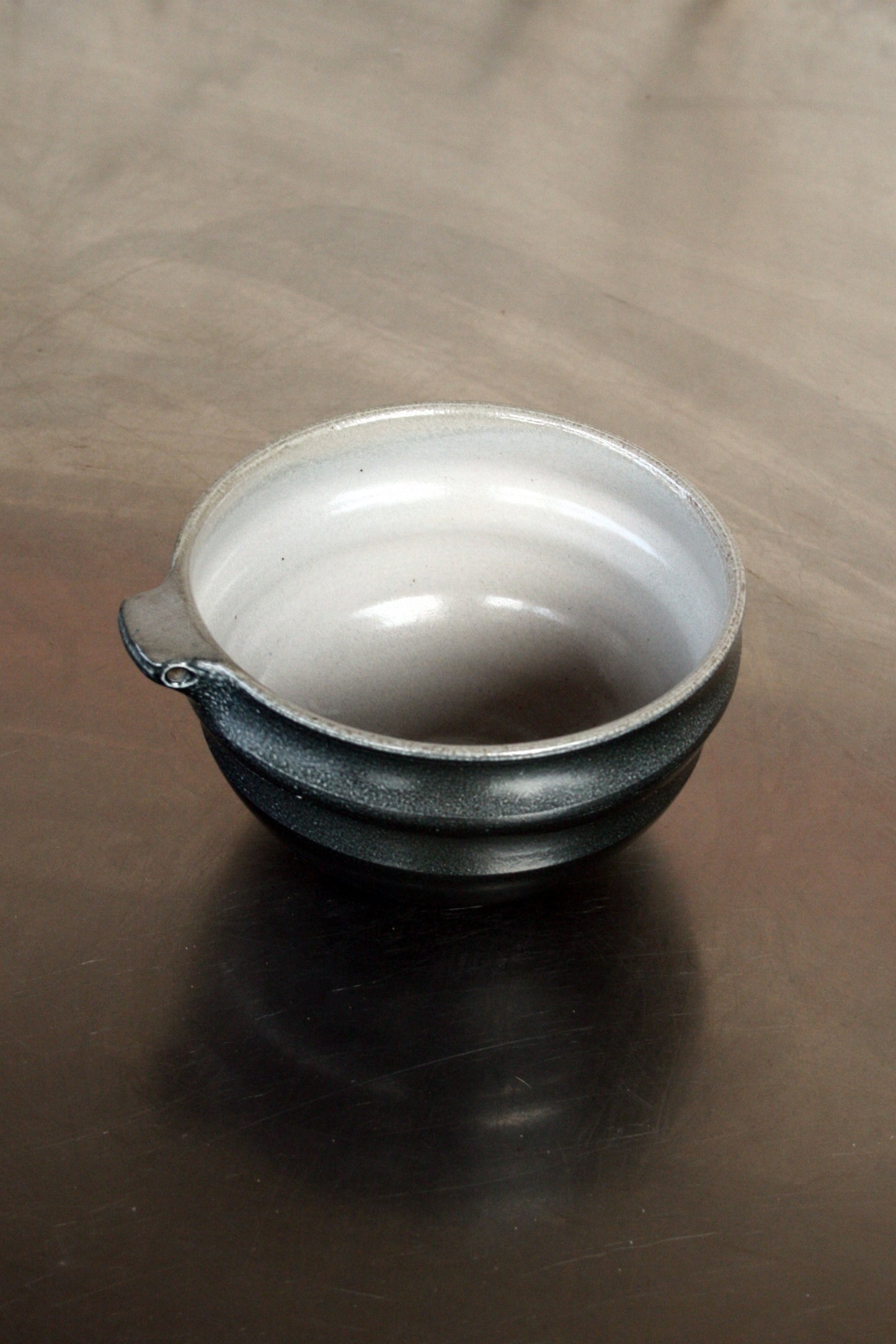 Bowl with pierced lug