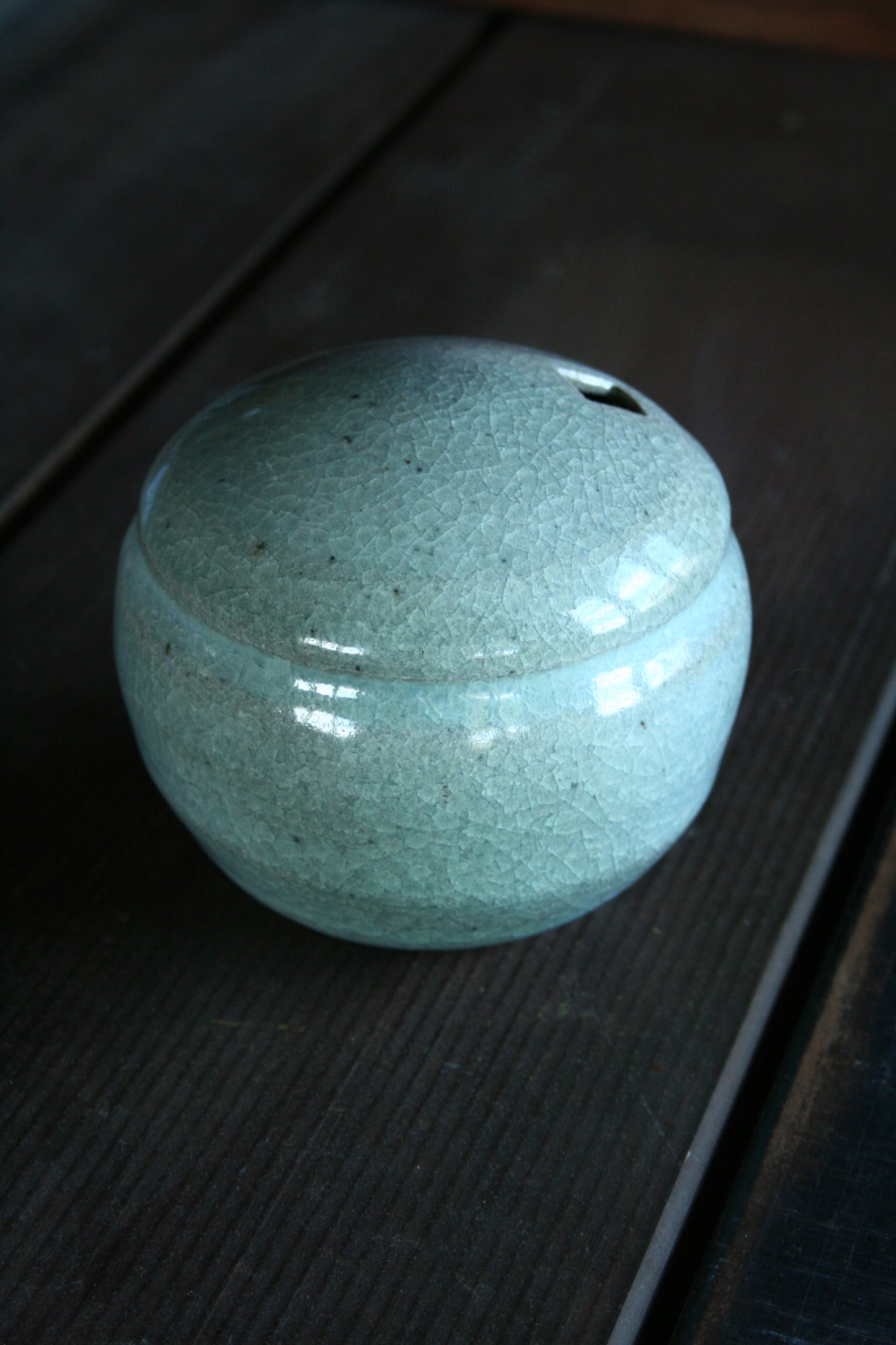 Enclosed form vase