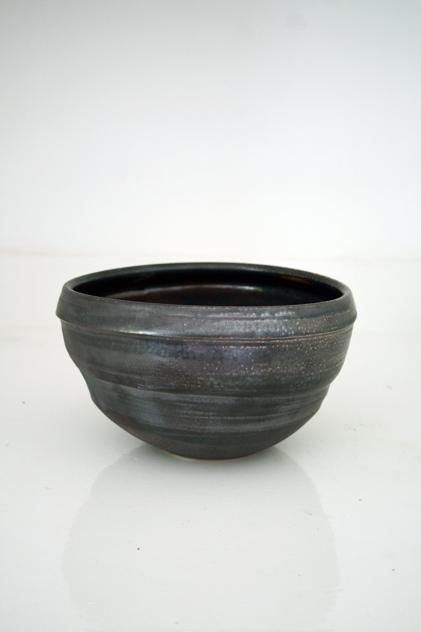 Asymmetric serving bowl in black slip