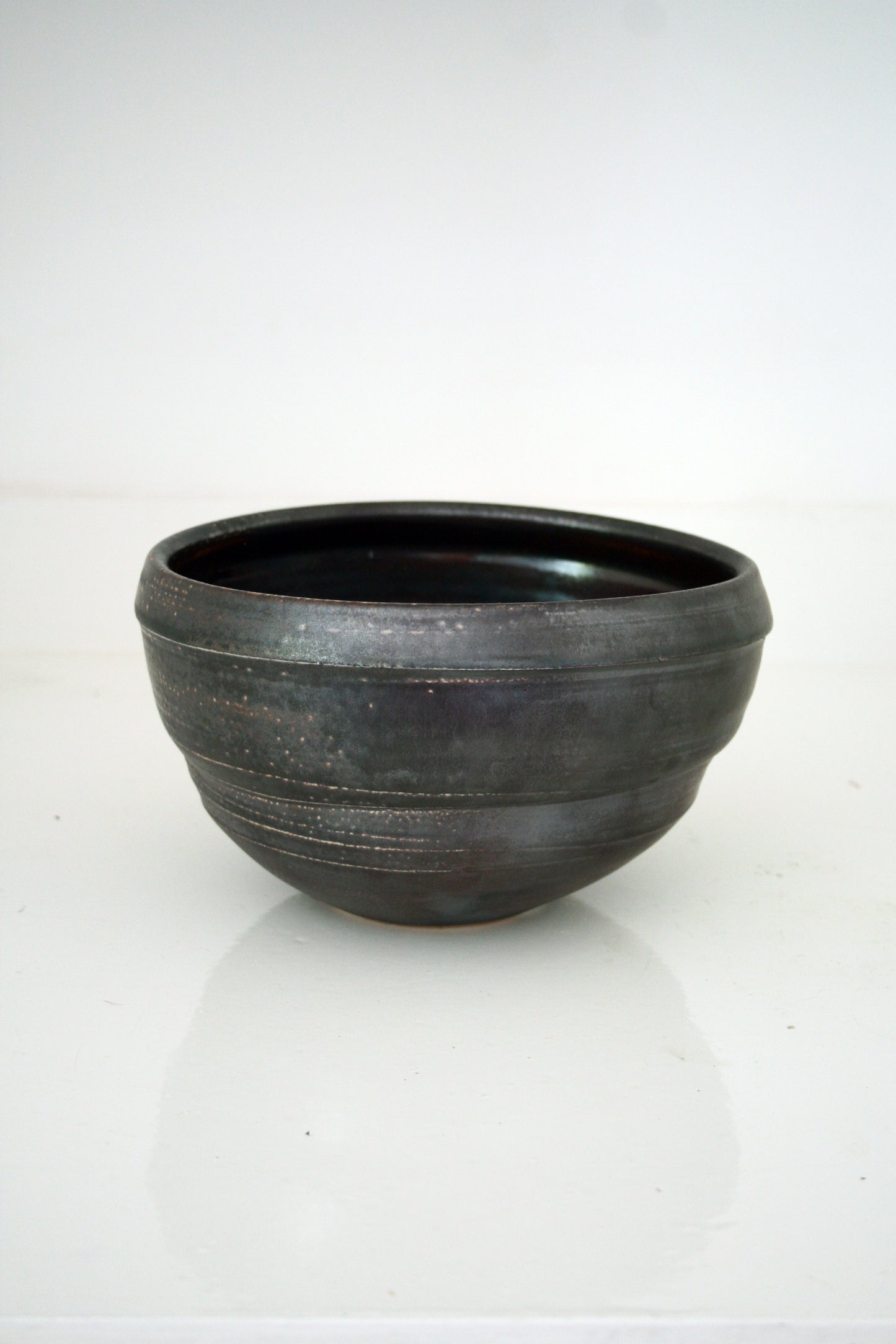 Asymmetric serving bowl in black slip