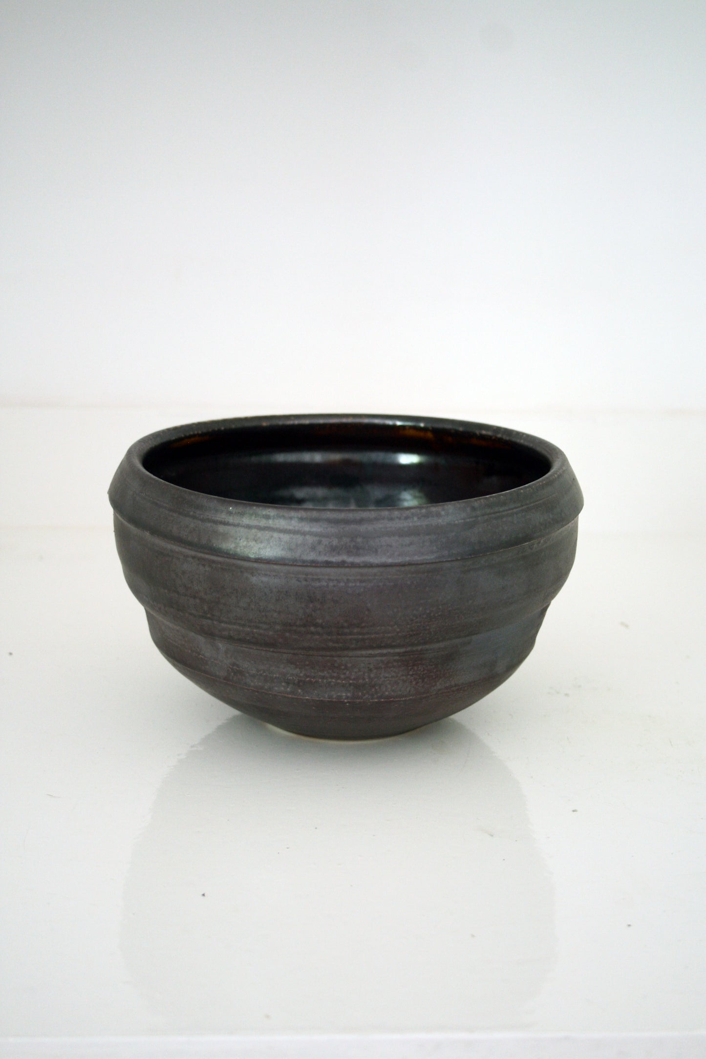 Asymmetric serving bowl in black slip