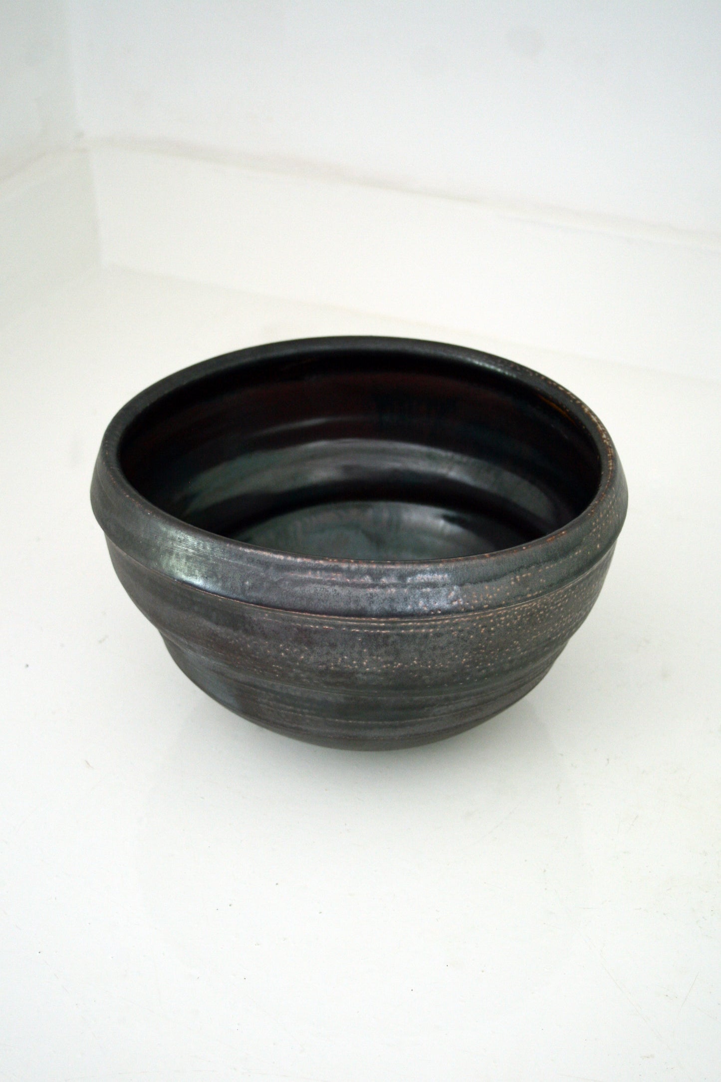 Asymmetric serving bowl in black slip