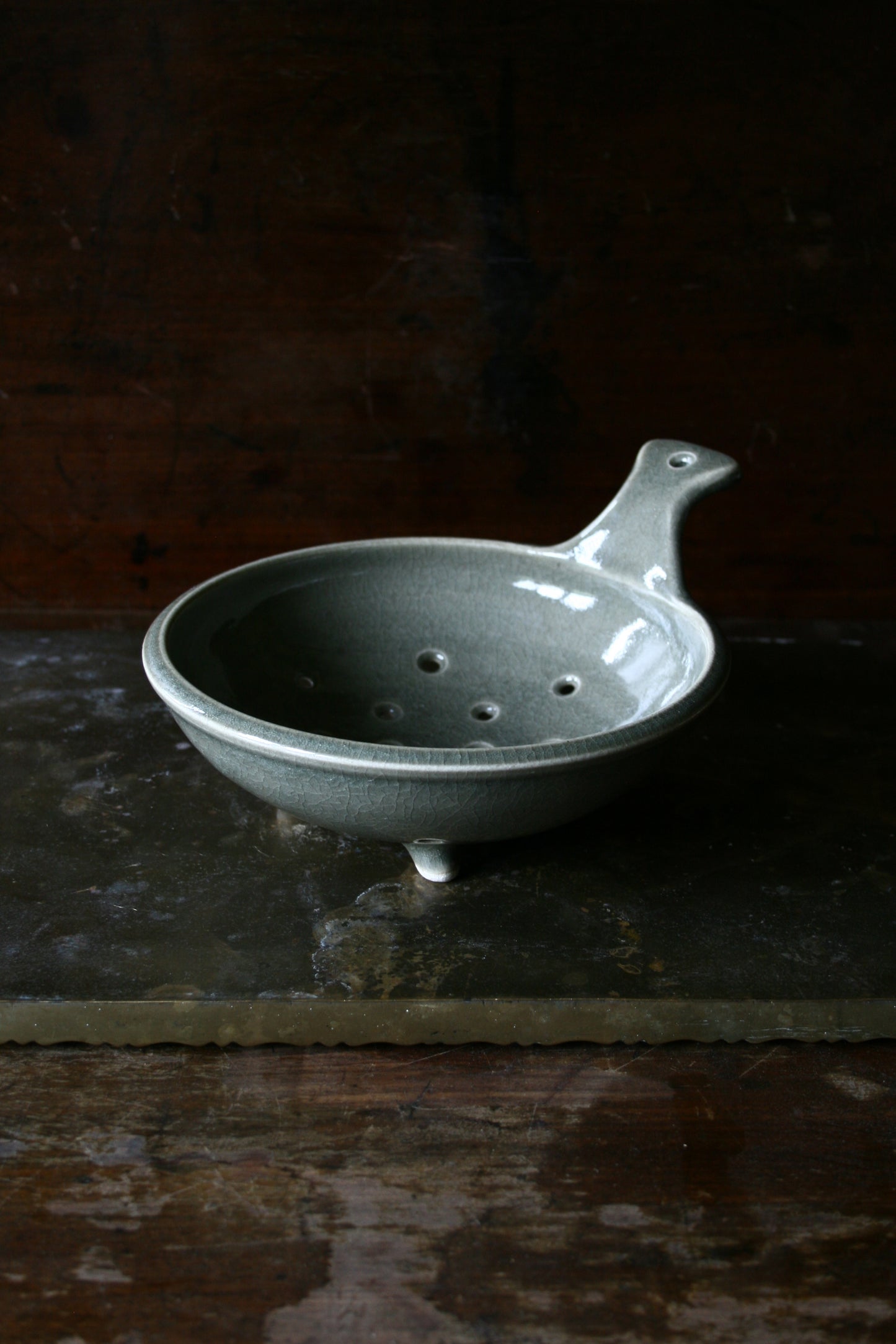 Celadon tripod colander with handle