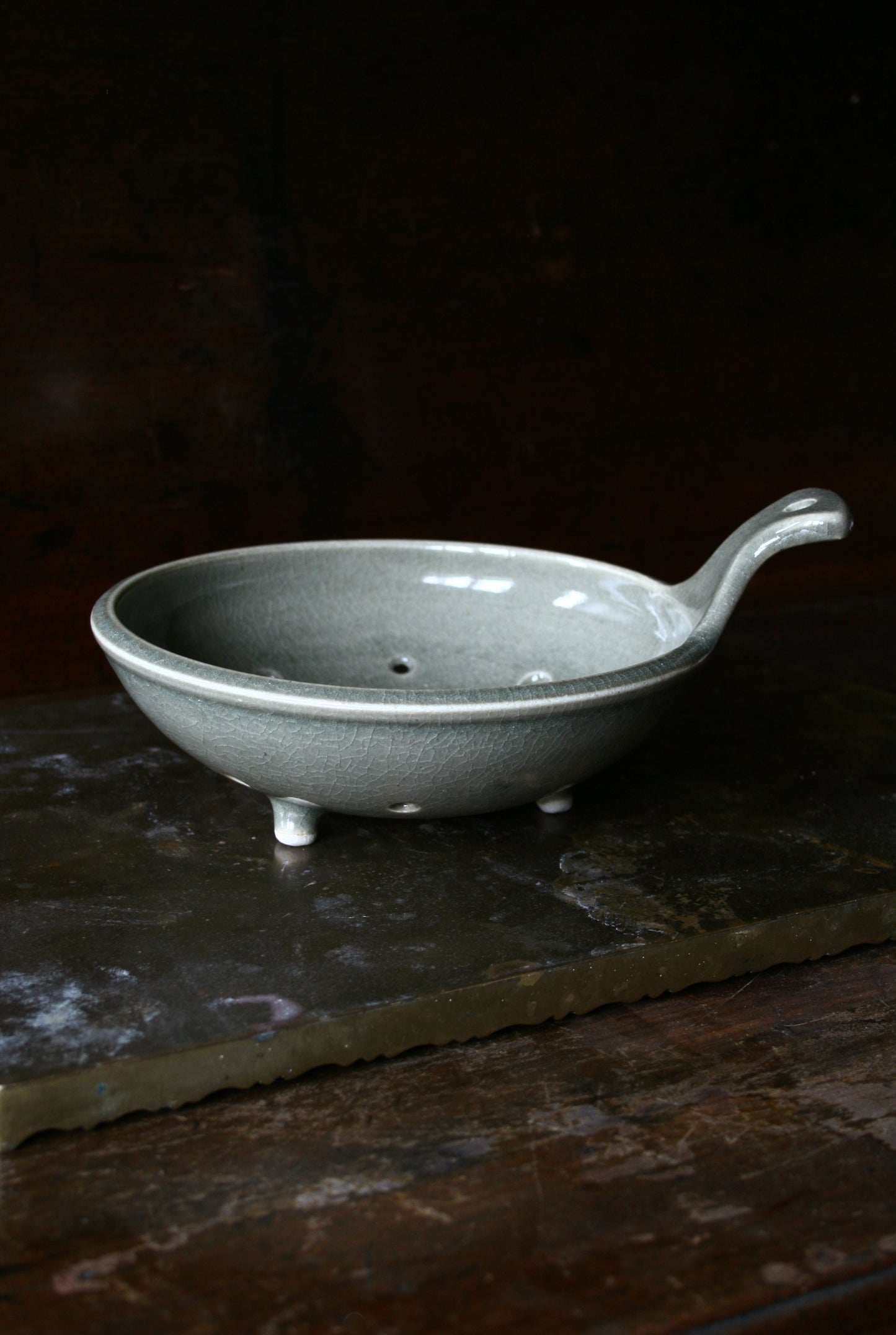 Celadon tripod colander with handle