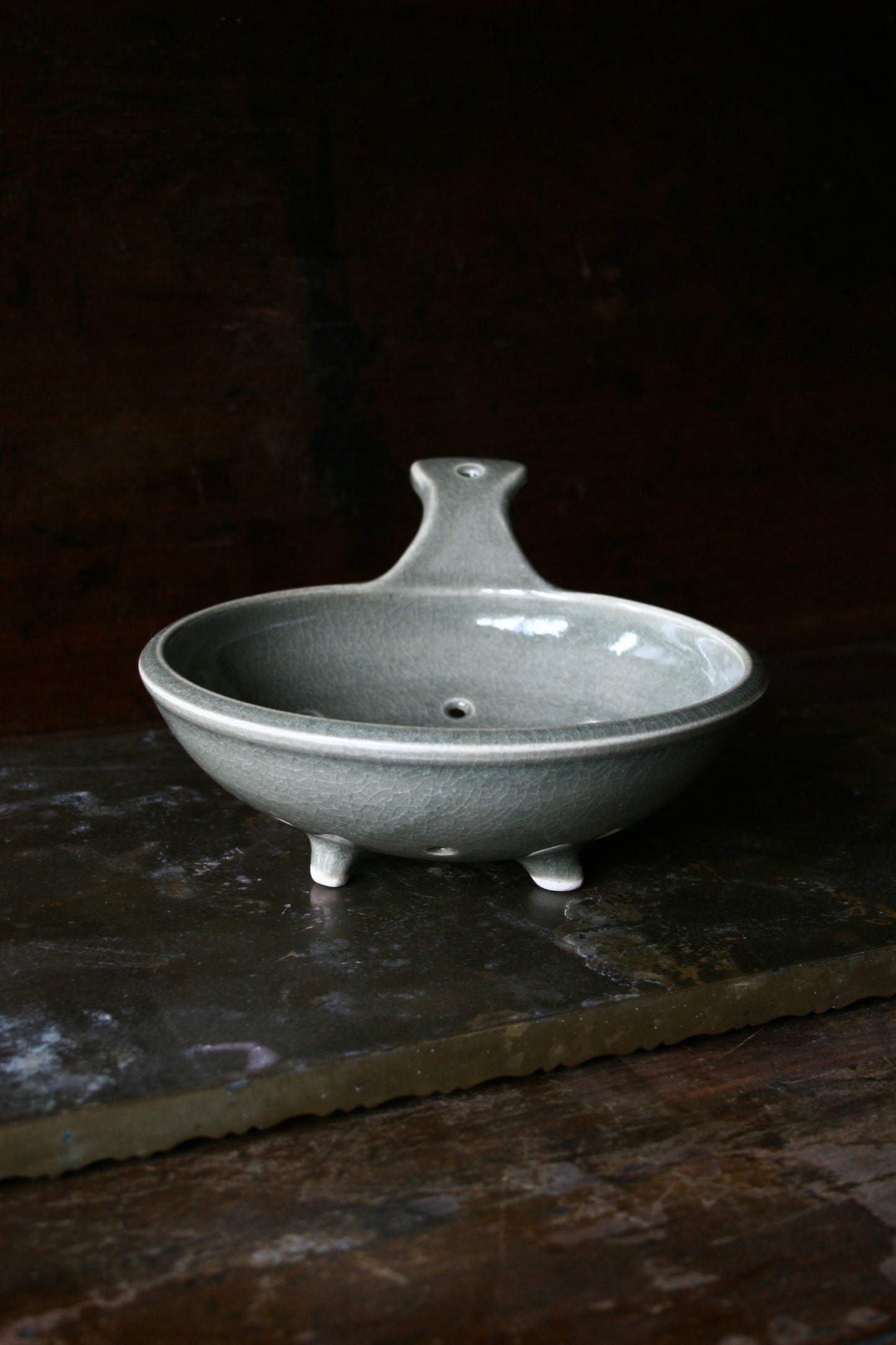 Celadon tripod colander with handle