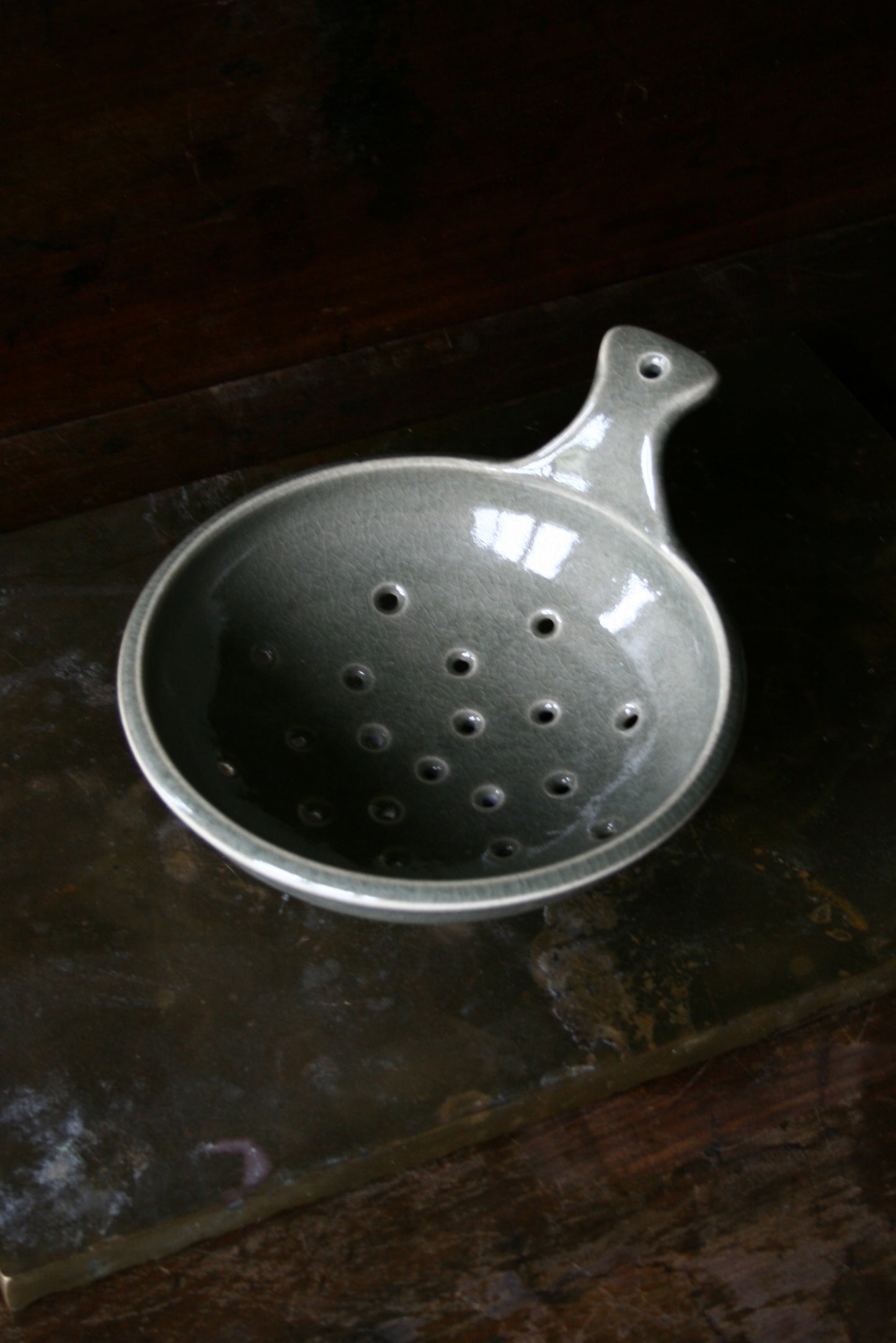 Celadon tripod colander with handle