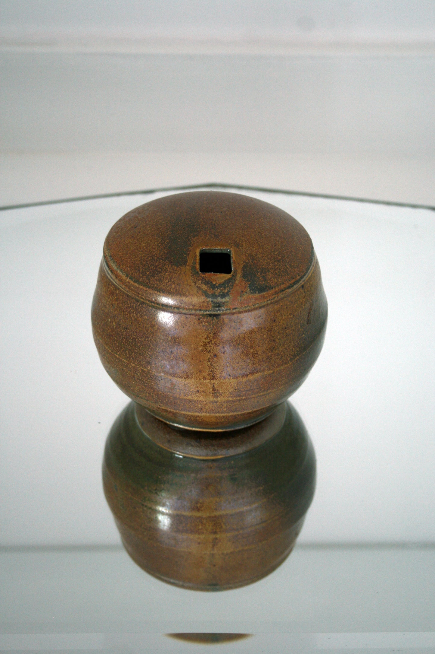 Enclosed vase with square opening