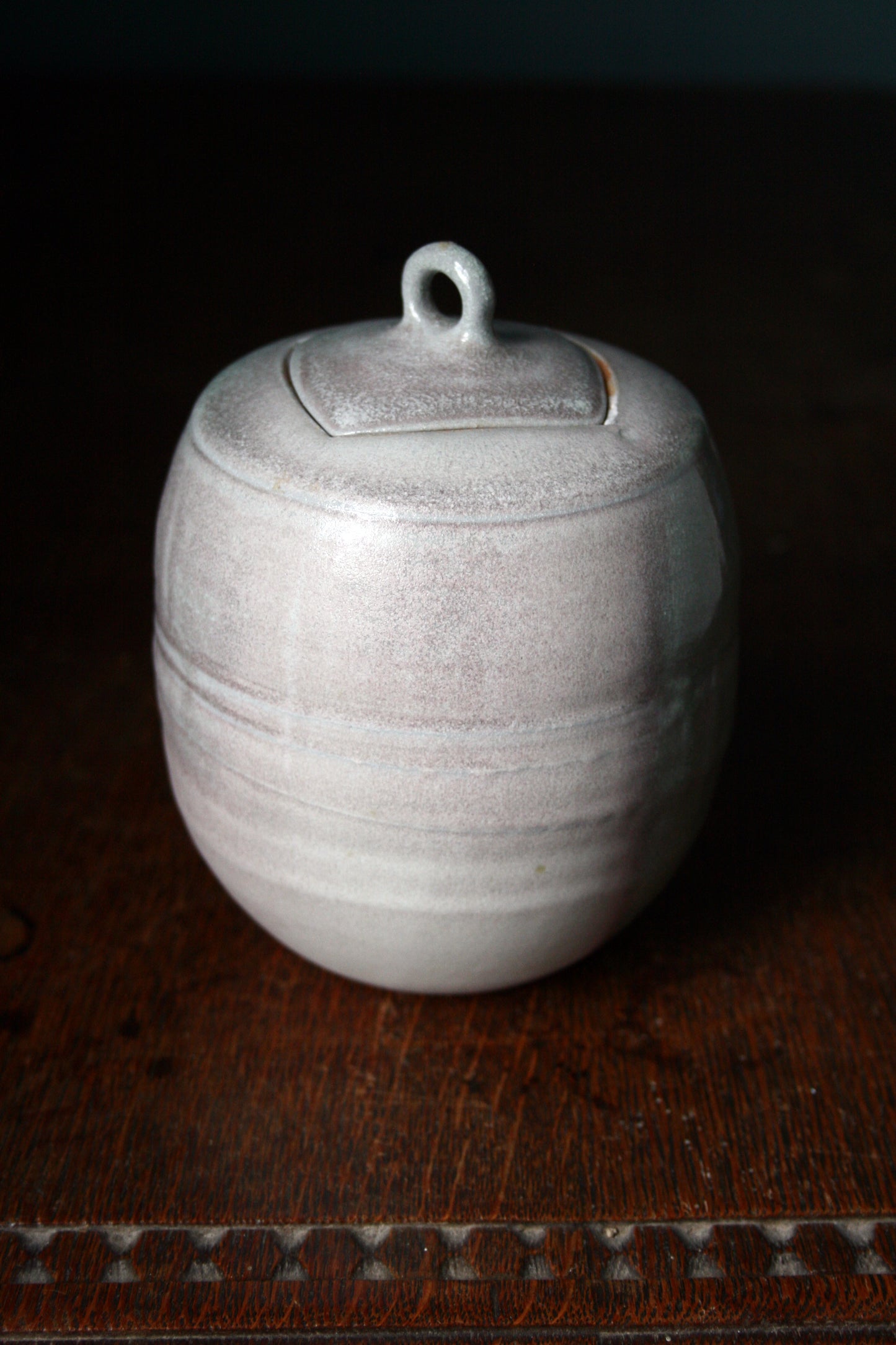 Jar with carved lid