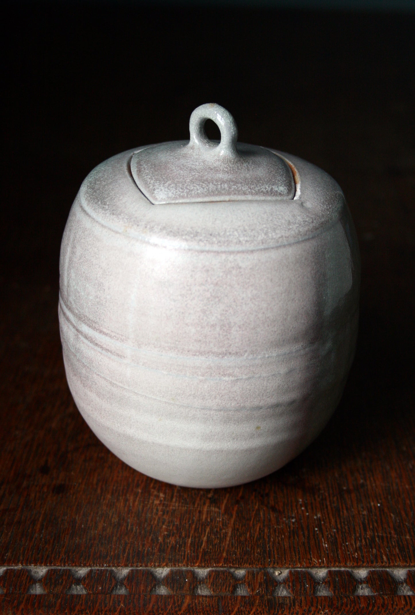 Jar with carved lid