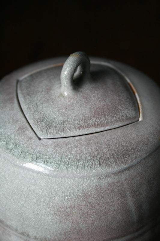 Jar with carved lid