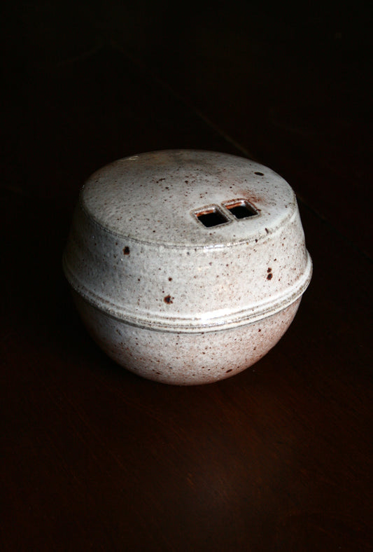 Enclosed form vase with double square opening