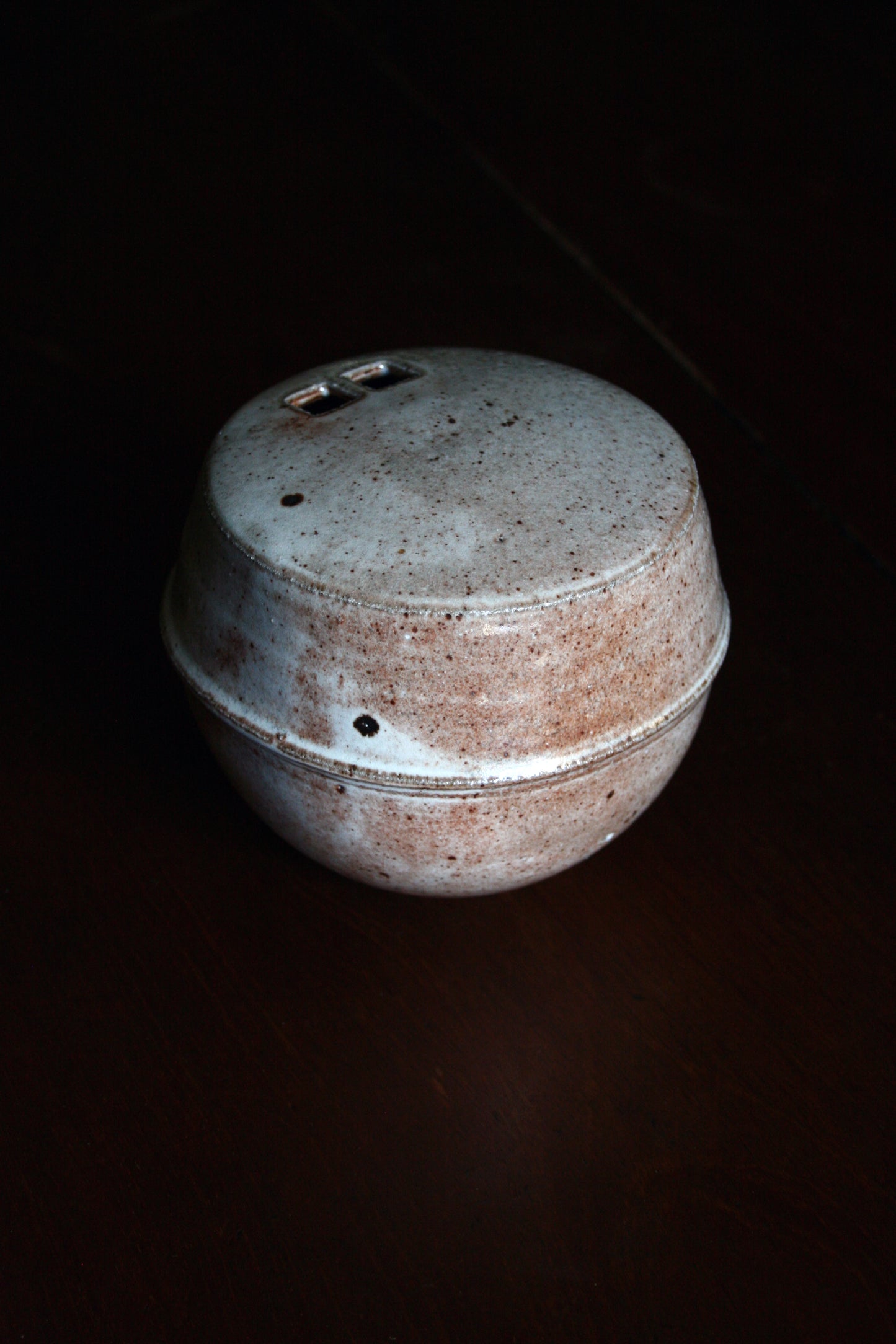 Enclosed form vase with double square opening