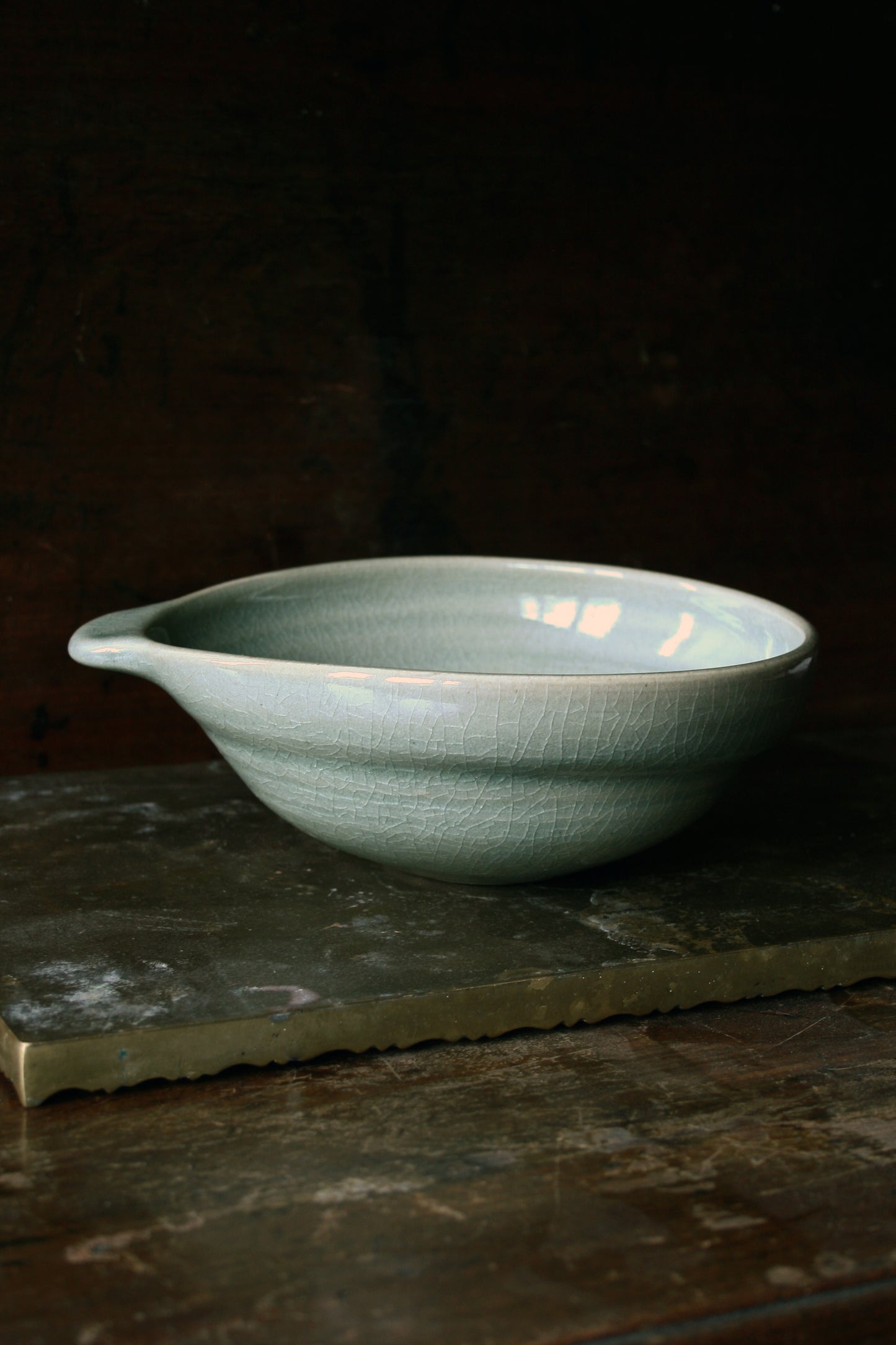 Oval handled bowl in green celadon