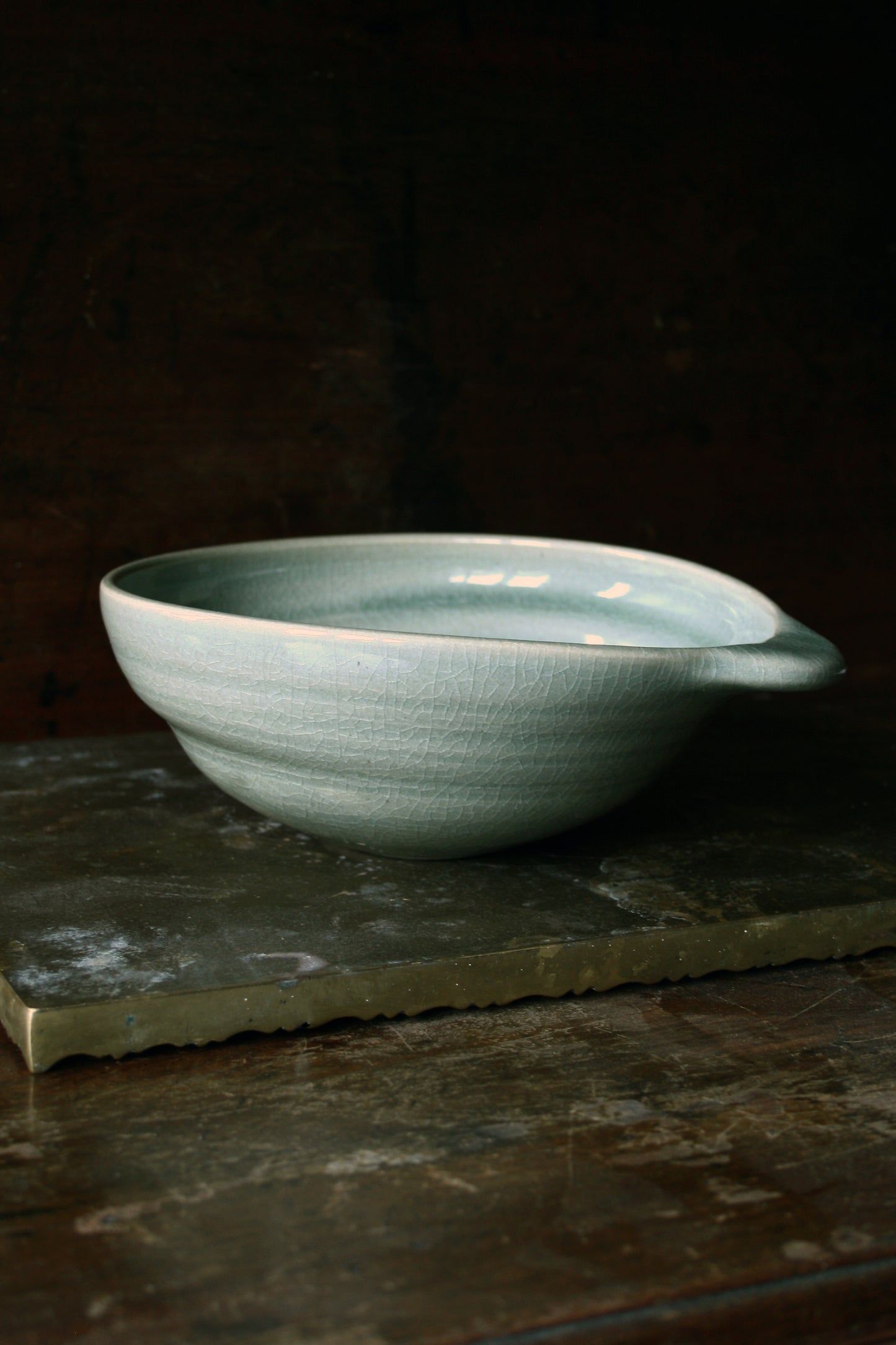 Oval handled bowl in green celadon