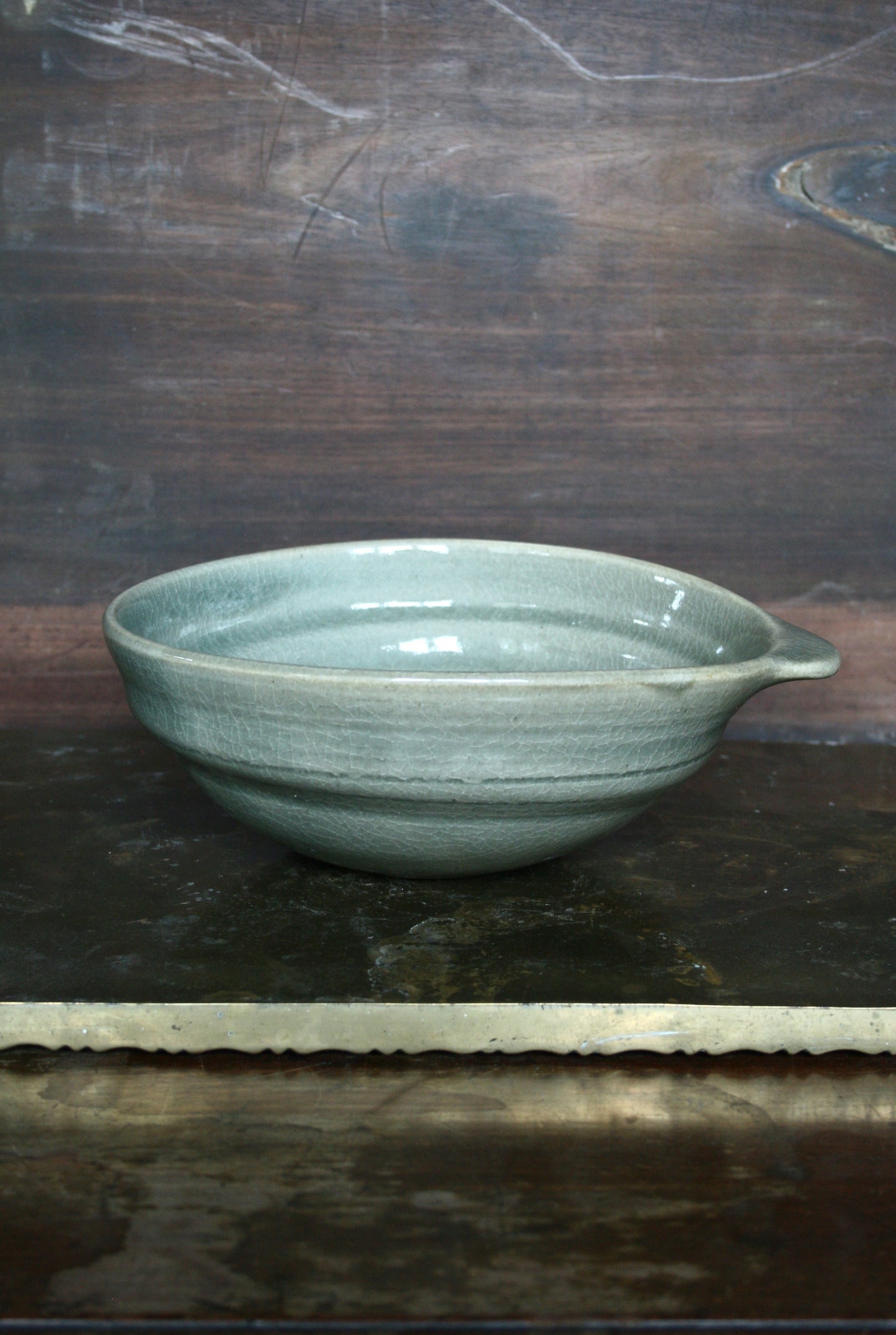 Oval handled bowl in green celadon