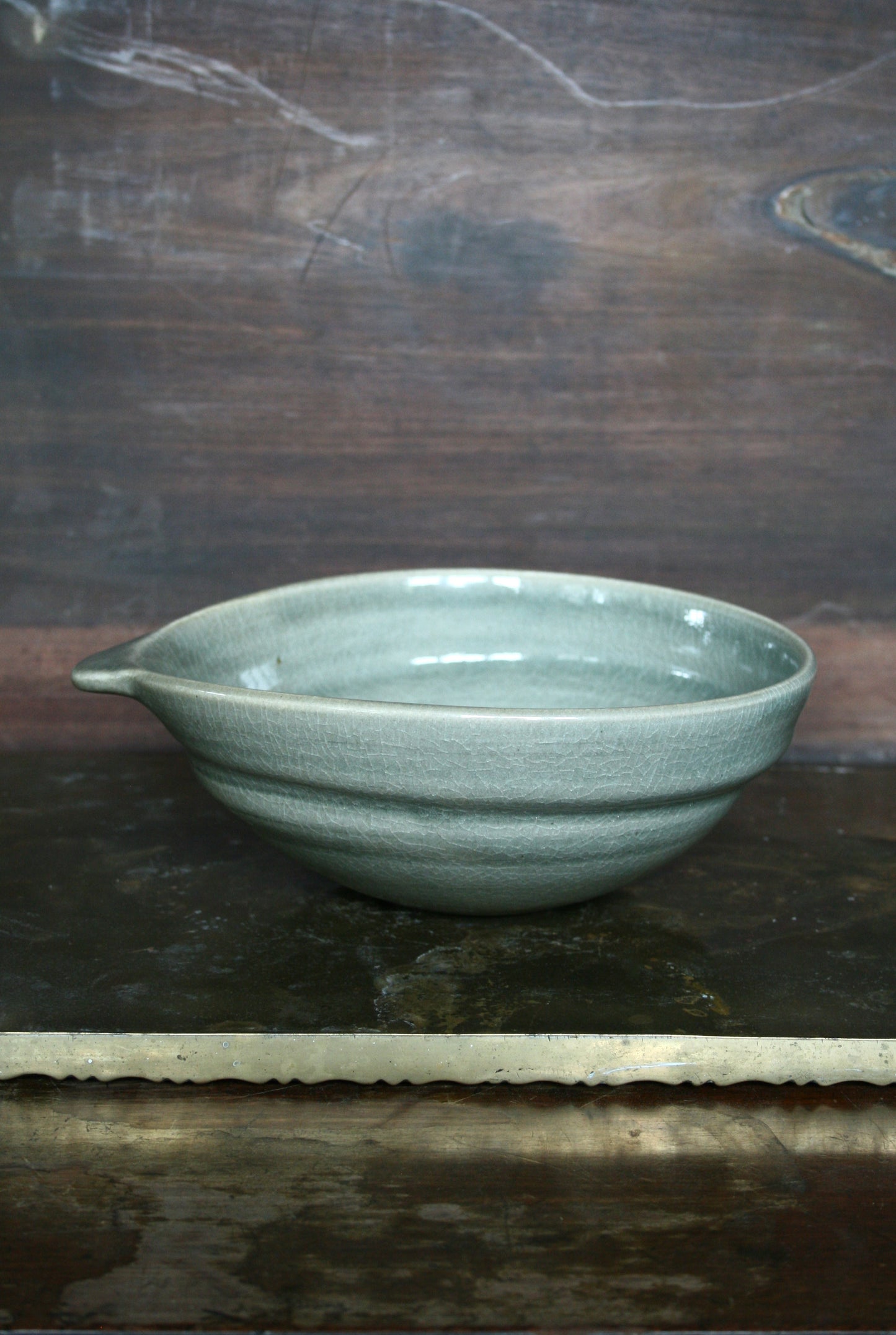 Oval handled bowl in green celadon