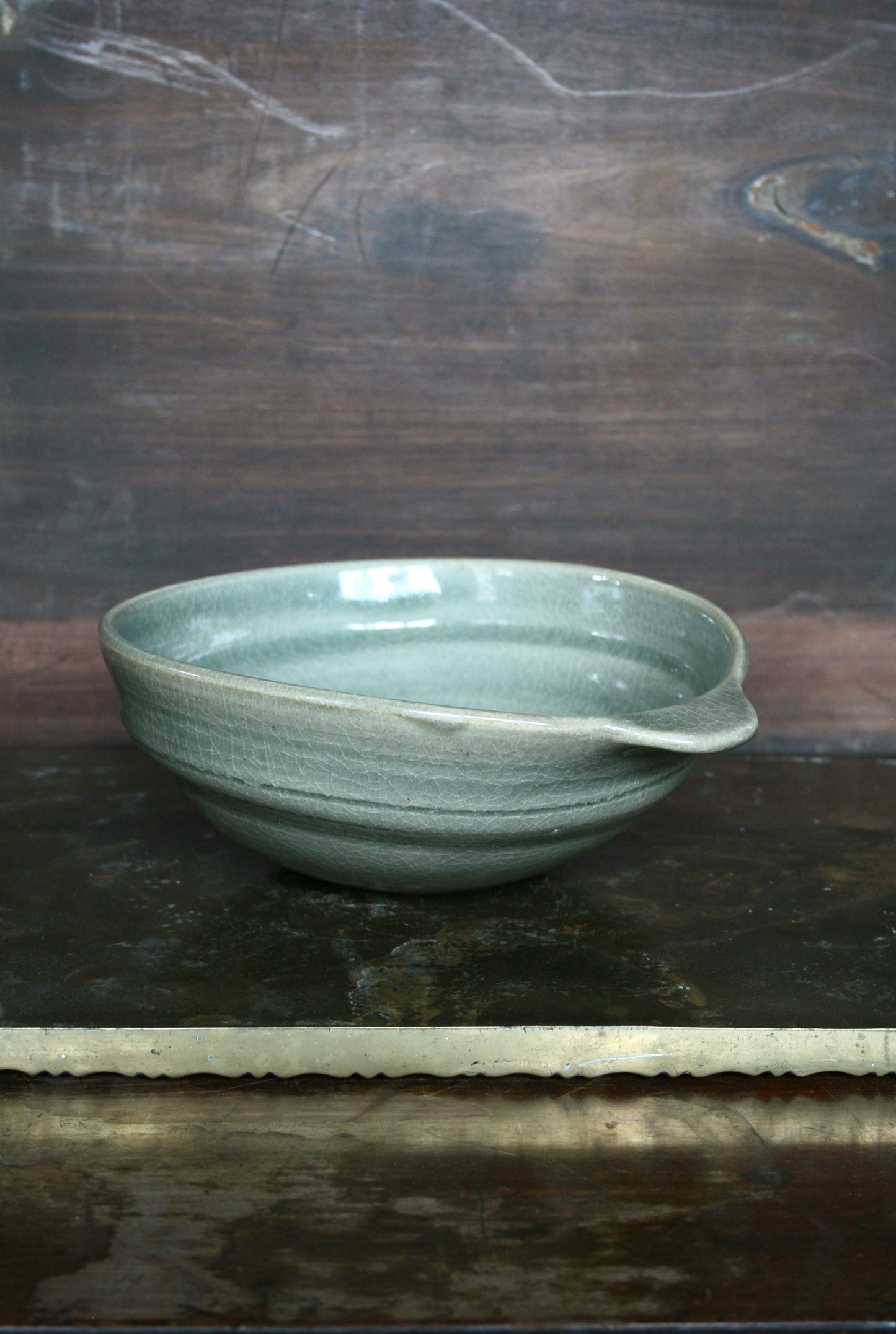 Oval handled bowl in green celadon