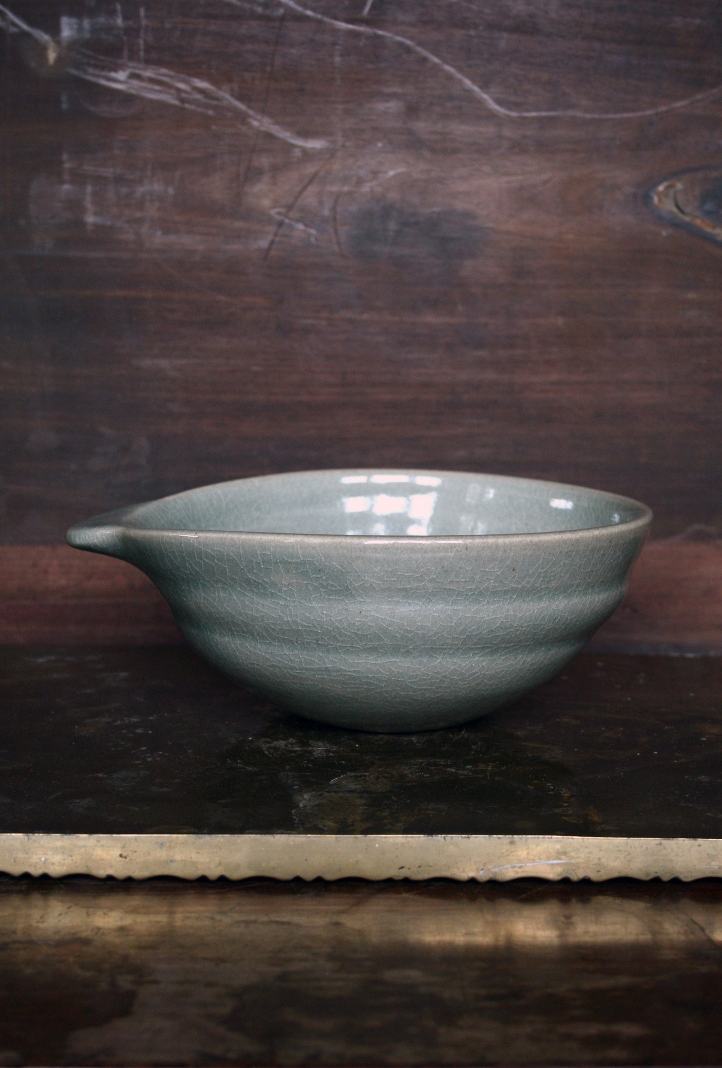 Oval handled bowl in green celadon