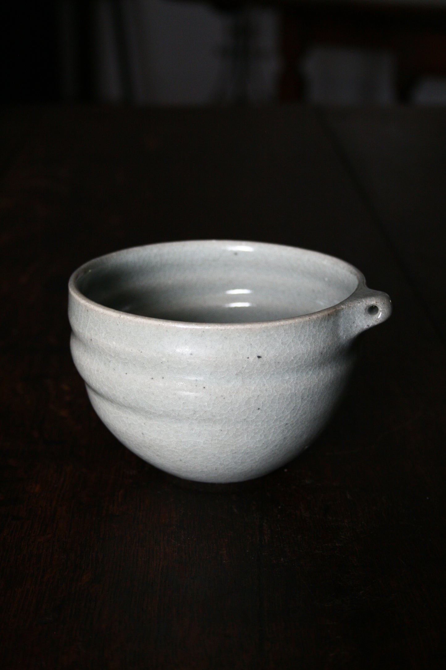 Bowl with pierced lug in pale celadon