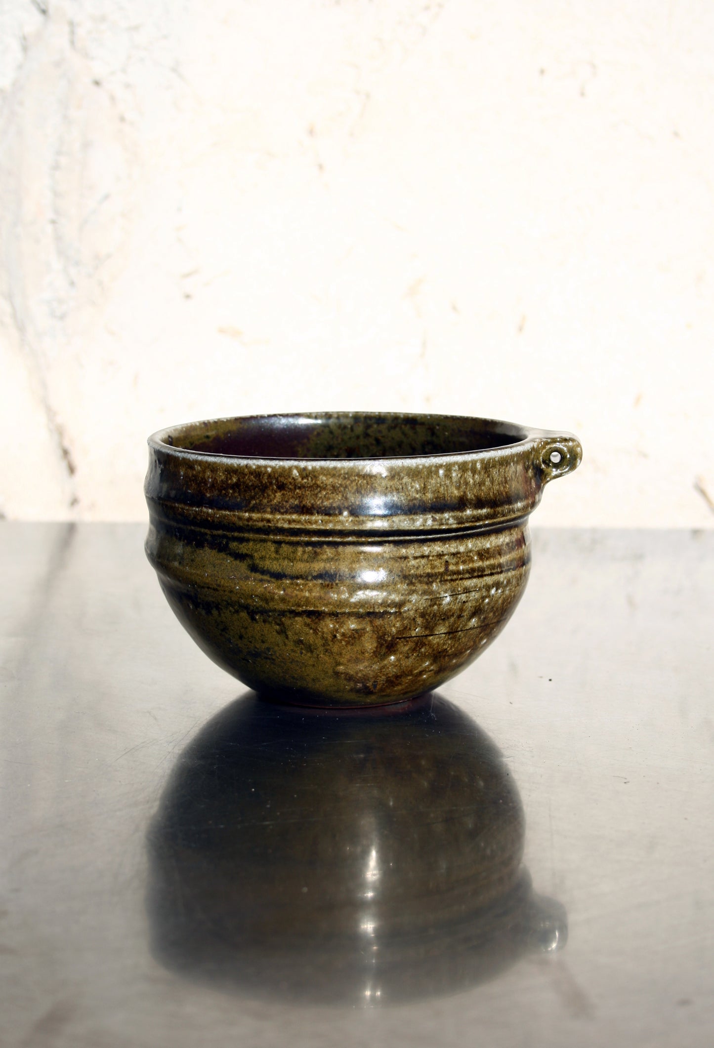 Bowl with pierced lug