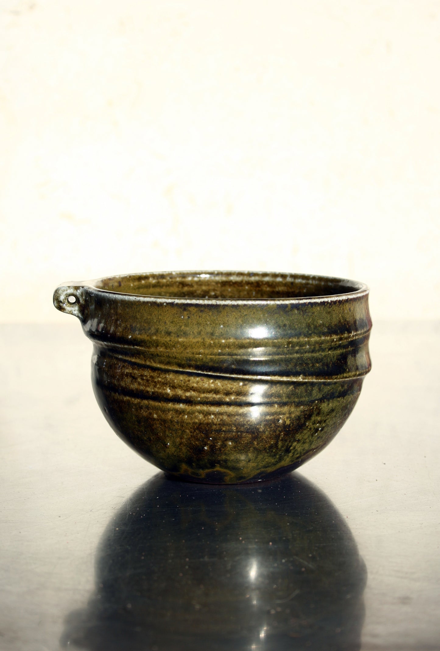 Bowl with pierced lug