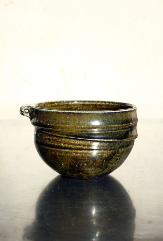 Bowl with pierced lug