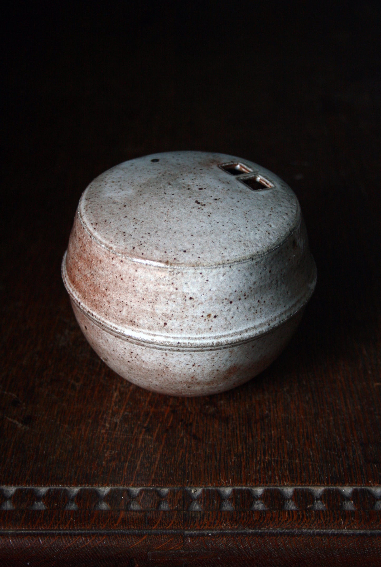 Enclosed form vase
